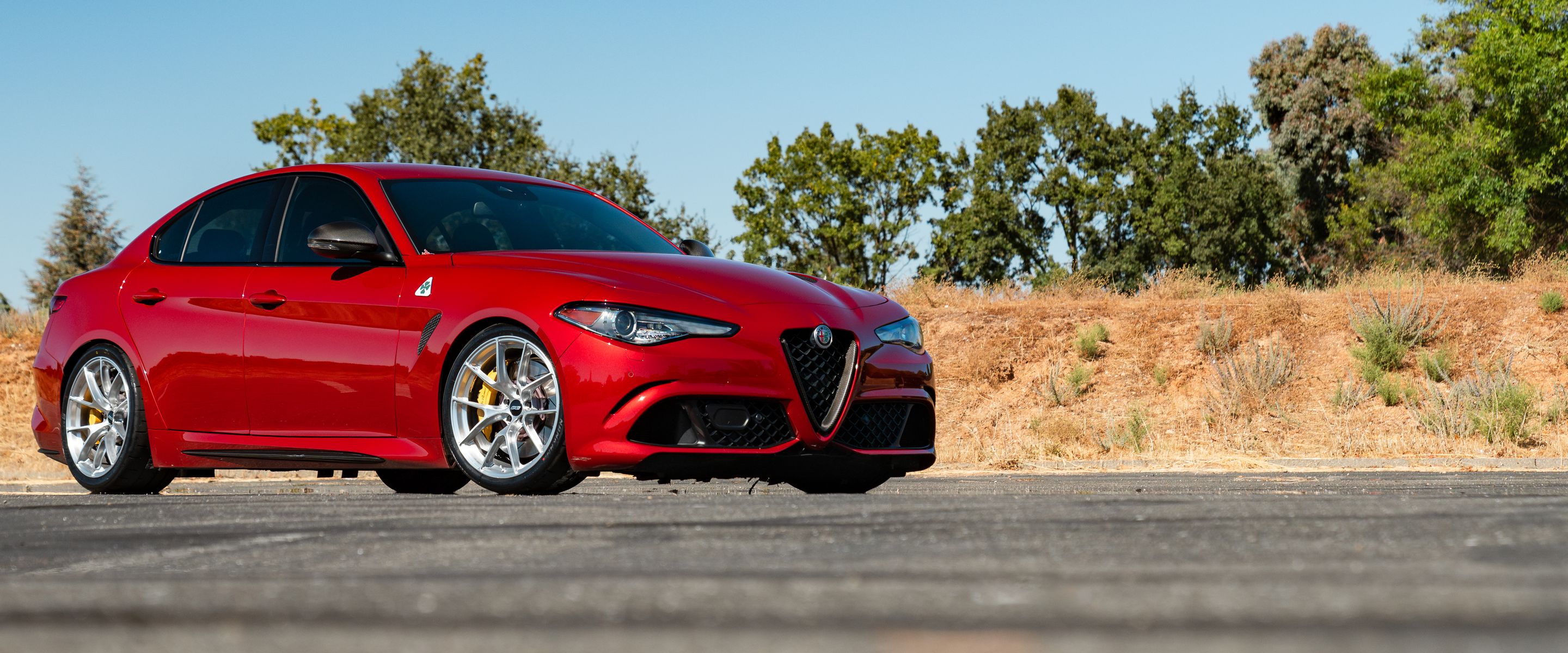 Red Alfa Romeo Giulia Quadrifoglio with 19" VS-5RS Apex wheels in Brushed Clear
