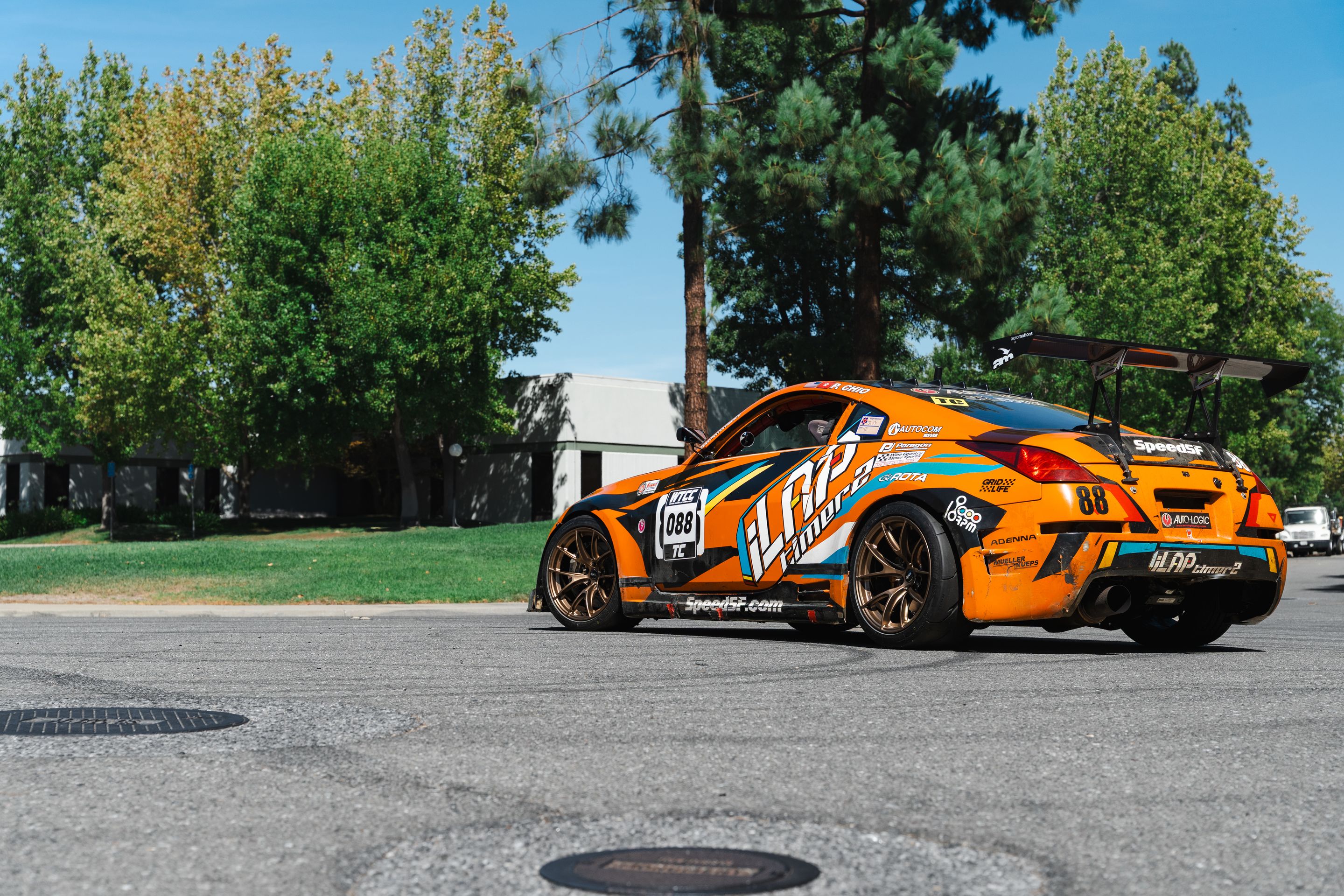 Orange Nissan 350Z with 18" VS-5RS Apex wheels in Satin Bronze