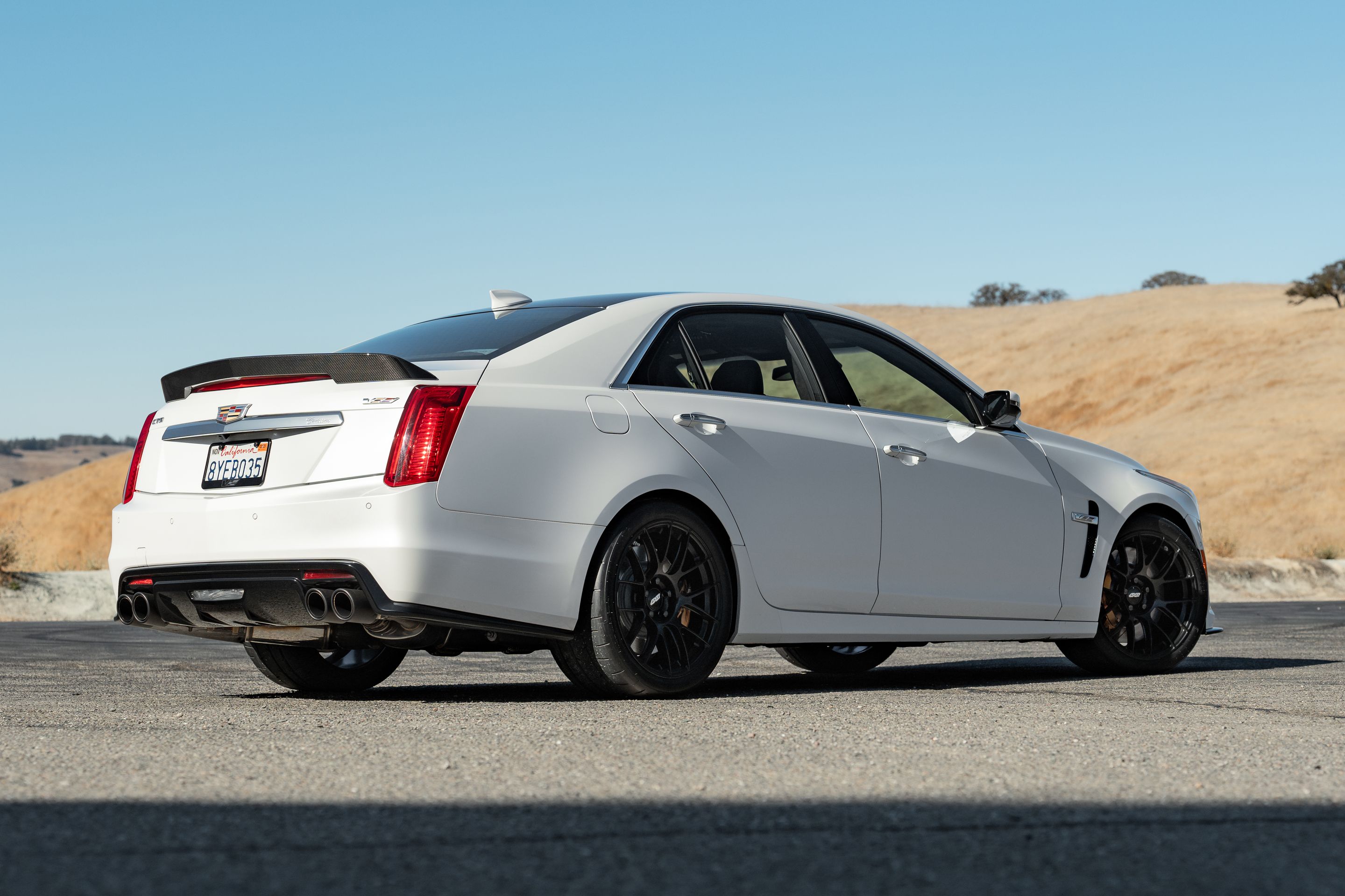 White Cadillac Gen 3 CTS-V with 19" EC-7RS Apex wheels in Satin Black