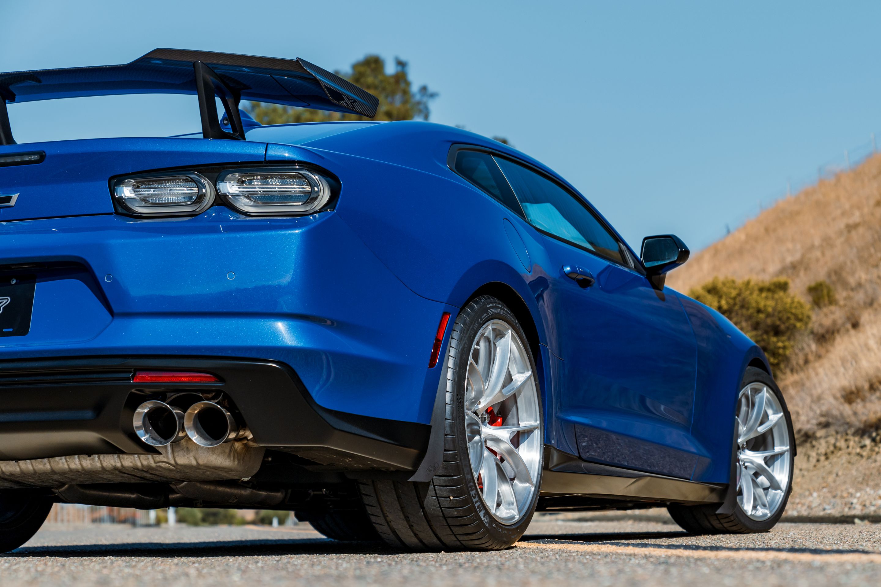 Blue Chevrolet 6th Gen Camaro ZL1 1LE with 20" VS-5RS Apex wheels in Brushed Clear