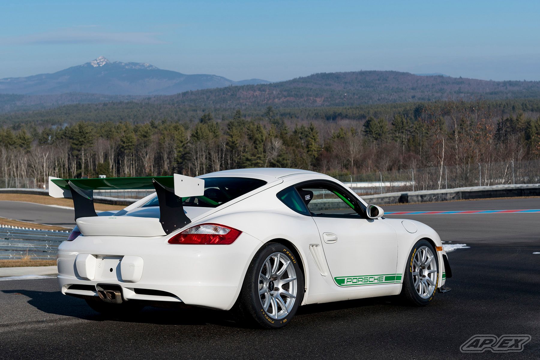 White Porsche 987 Cayman S with 18" SM-10 Apex wheels in Race Silver