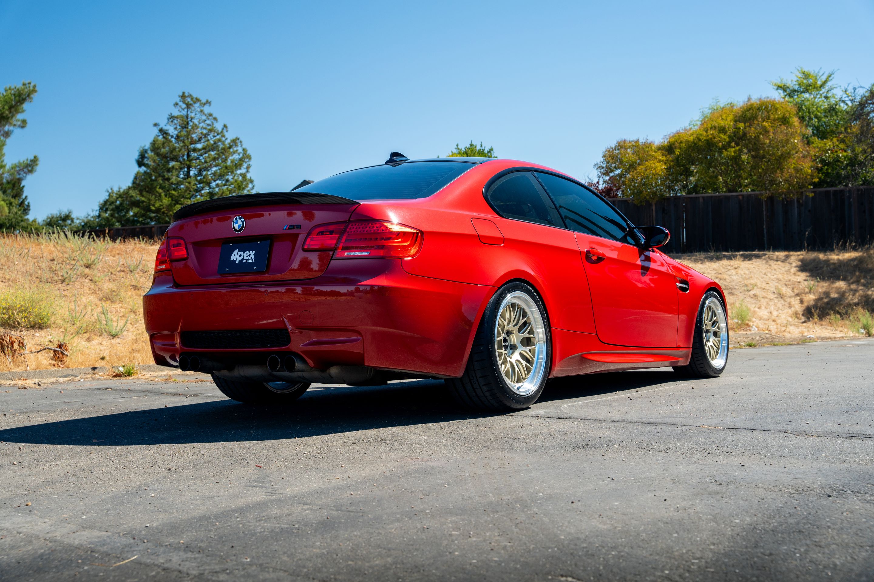 Red BMW E92 Coupe M3 with 18" ML-10RT Apex wheels in Machined Lip Gloss Motorsport Gold