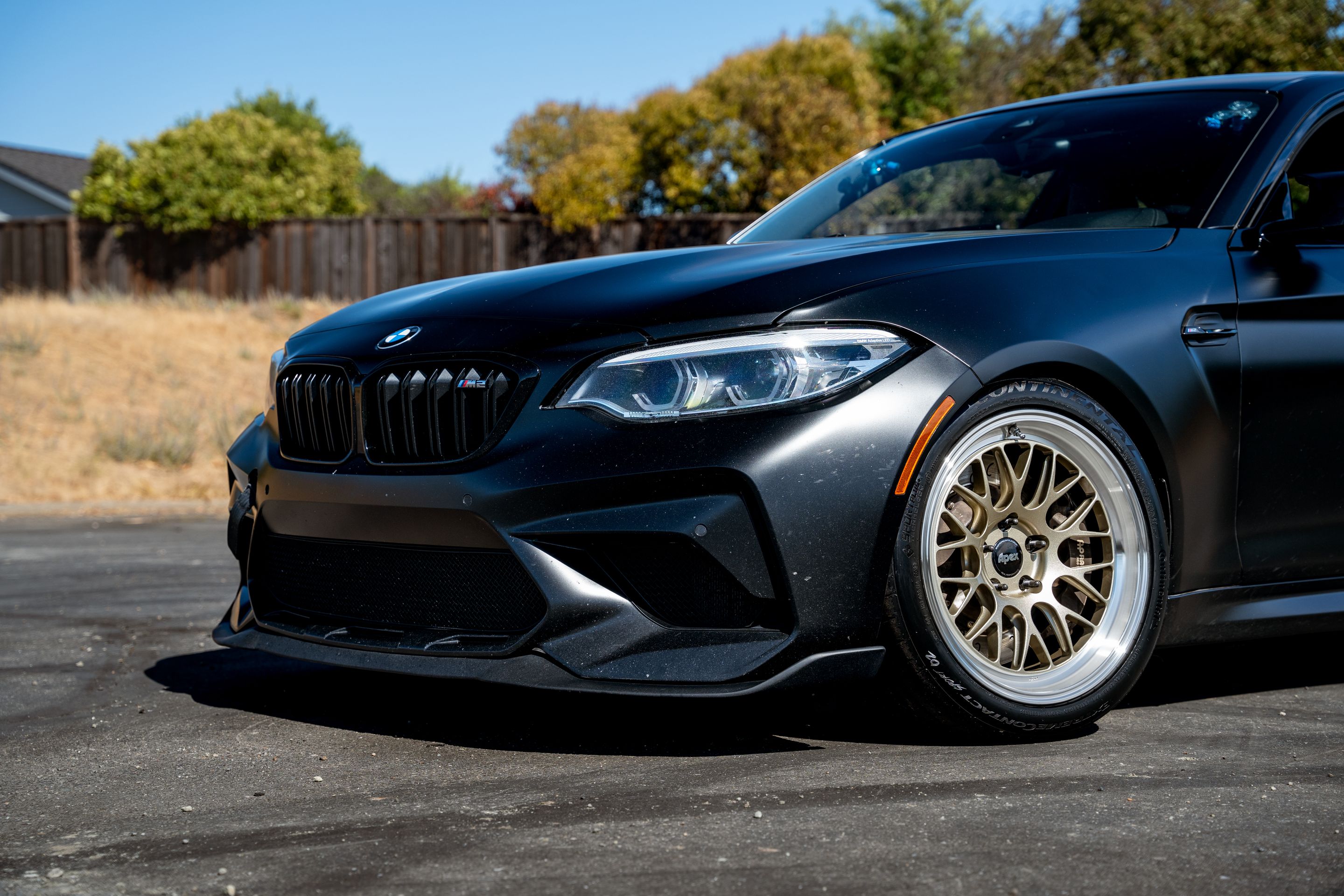 Black BMW F87 M2 with 18" ML-10RT Apex wheels in Machined Lip Gloss Motorsport Gold