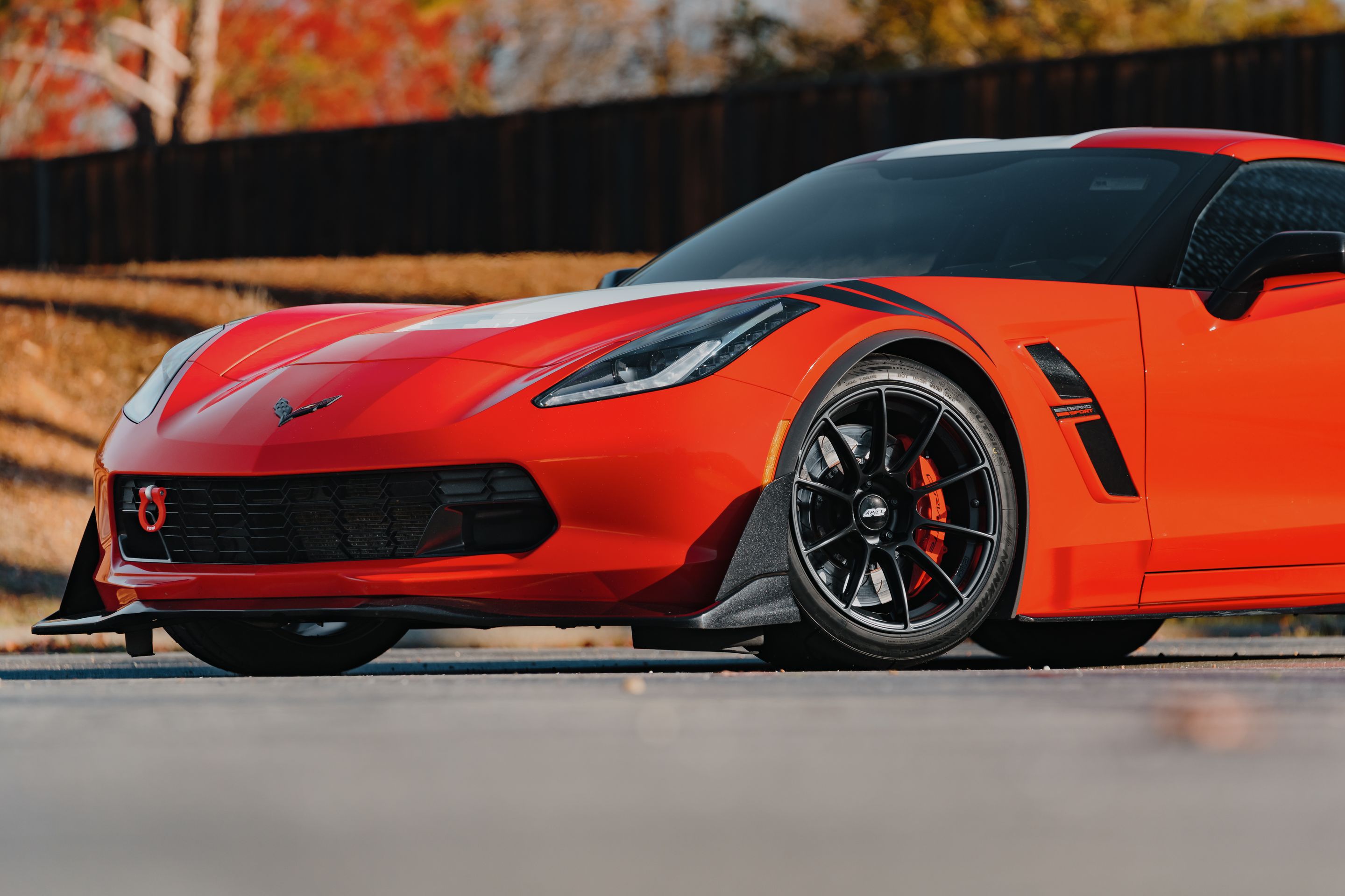 Red Chevrolet C7 Corvette Grand Sport with 18" SM-10RS Apex wheels in Satin Black