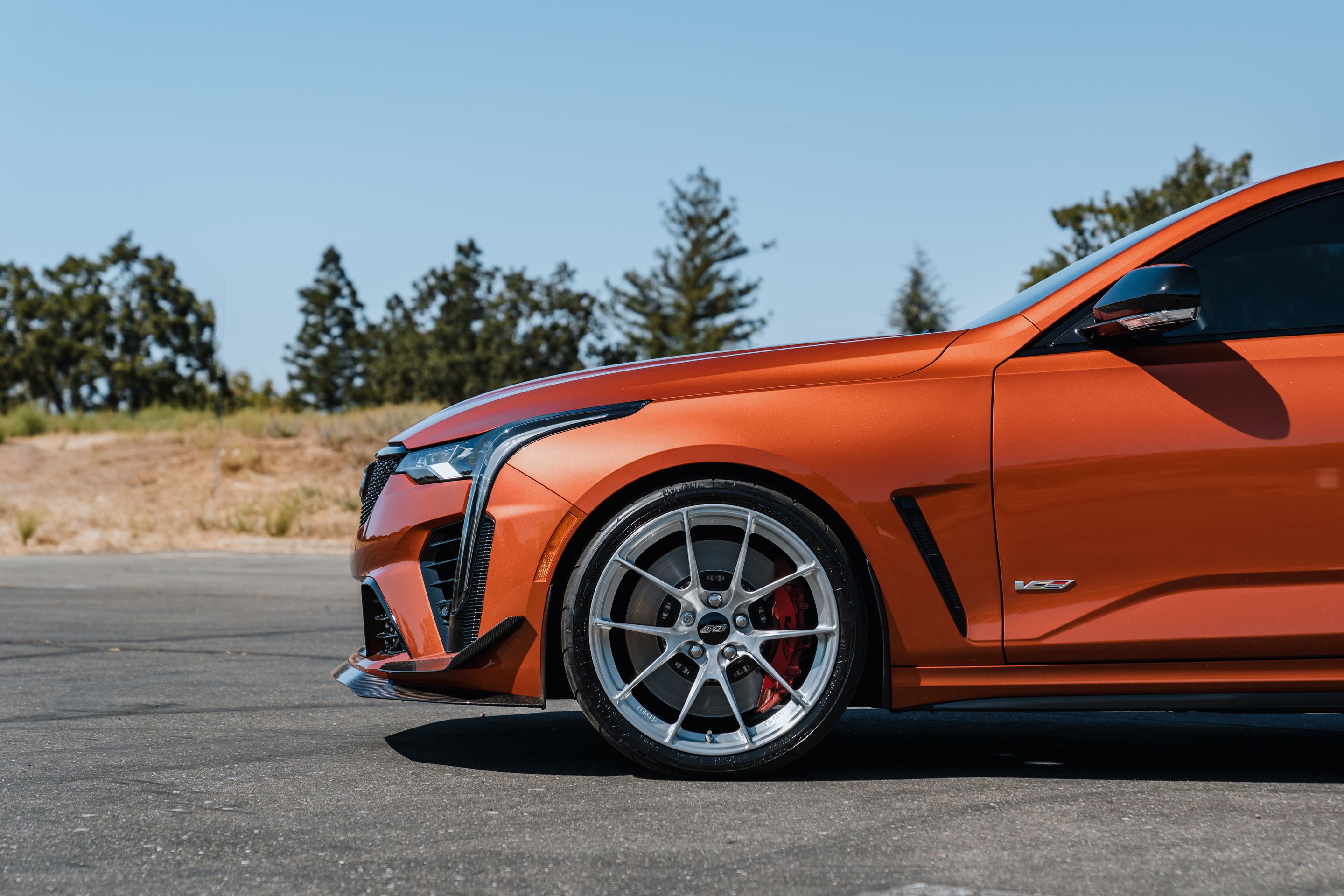 Orange Cadillac CT4-V Blackwing with 19" VS-5RS Apex wheels in Brushed Clear