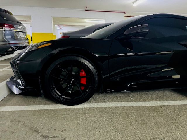 Black Chevrolet C8 Corvette Z06 with 20"/21" VS-5RS Apex wheels in Satin Black