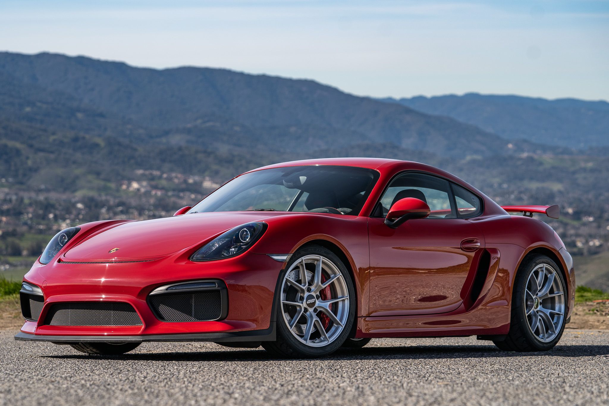 Red Porsche 981 Cayman GT4 with 19" VS-5RS Apex wheels in Brushed Clear