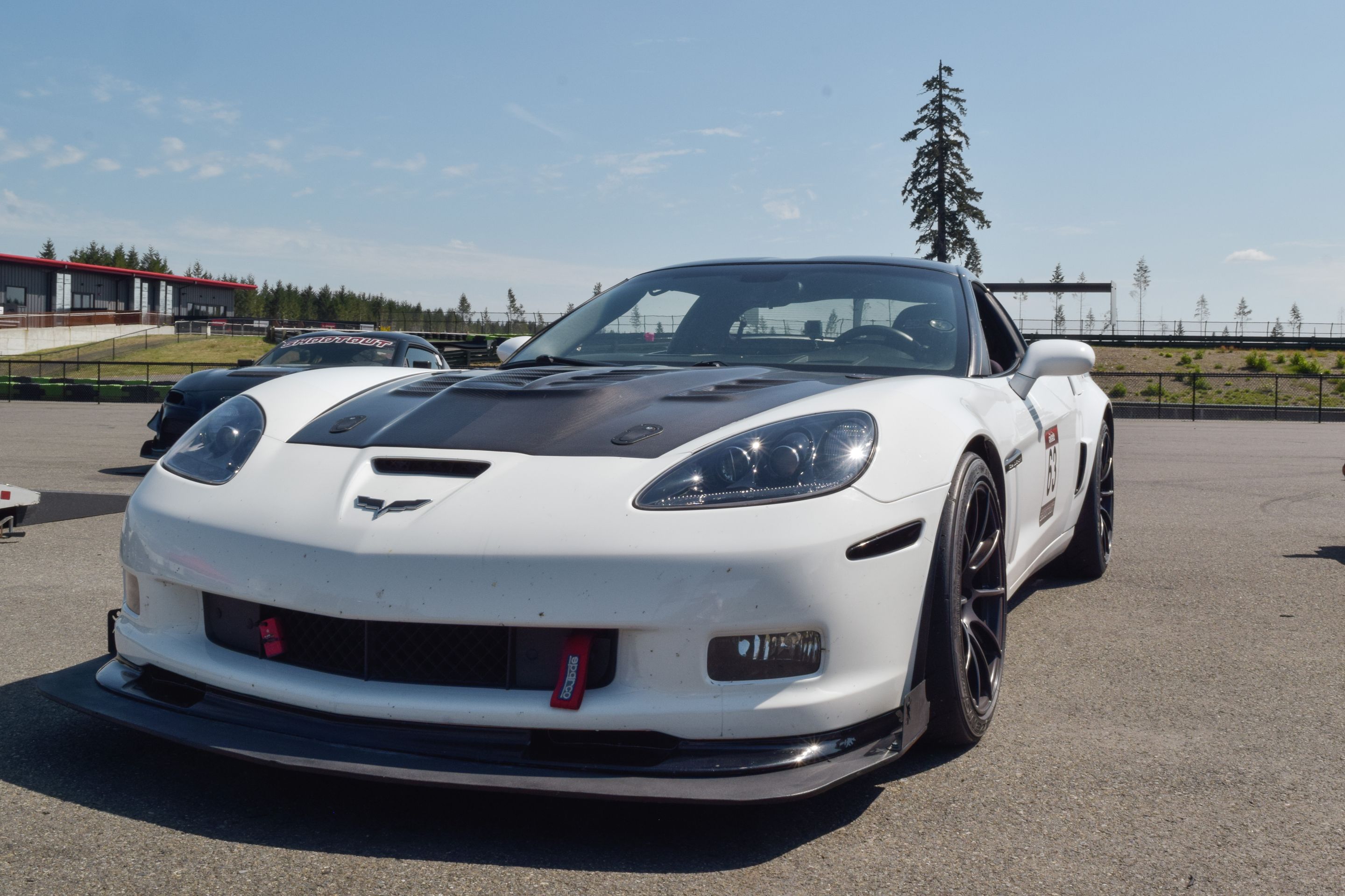 White Chevrolet C6 Corvette Grand Sport with 18"/19" SM-10RS Apex wheels in Satin Black