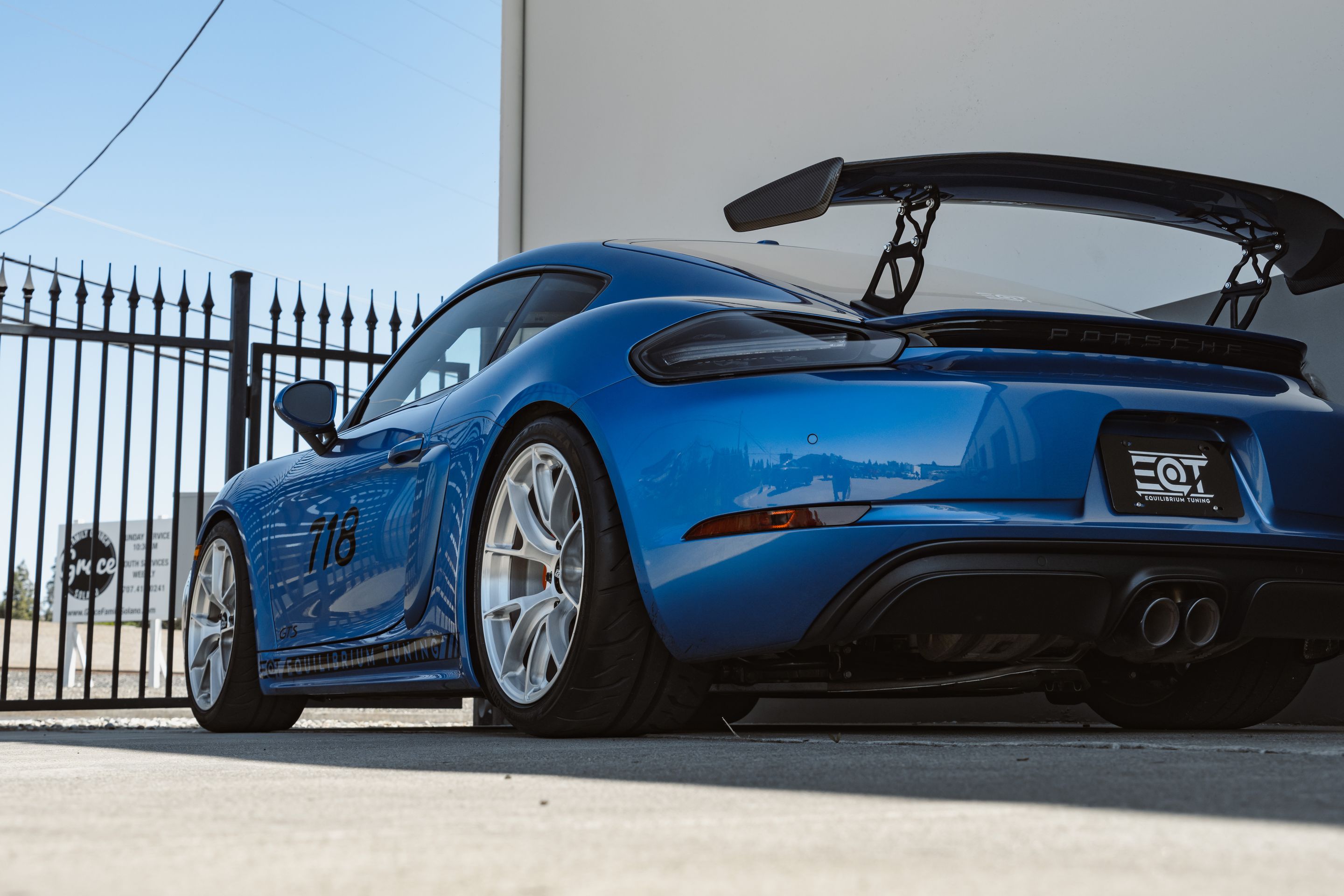 Blue Porsche 718 Cayman GTS 2.5L with 19" VS-5RS Apex wheels in Brushed Clear