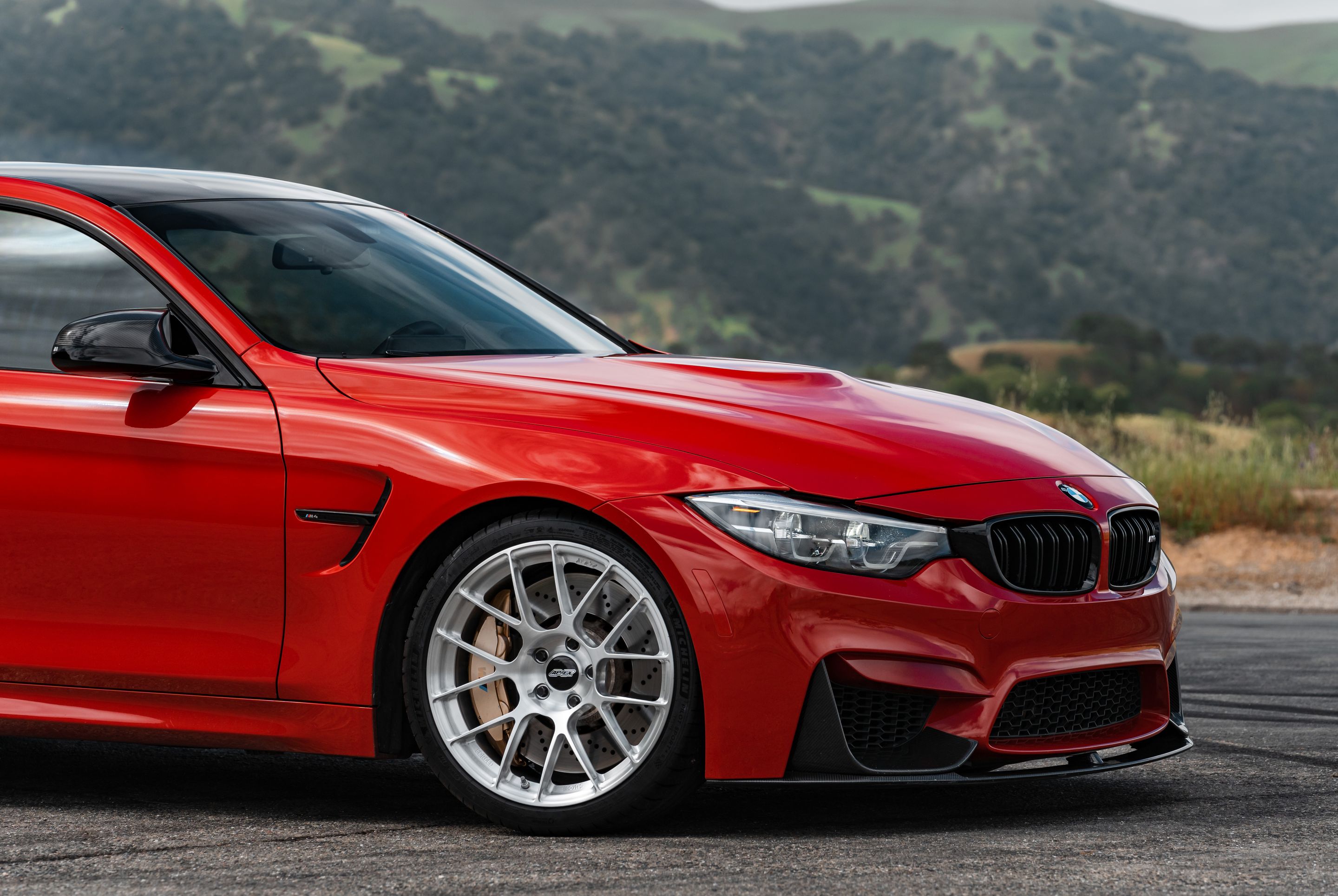 Red BMW F82 Coupe M4 with 19" EC-7RS Apex wheels in Brushed Clear