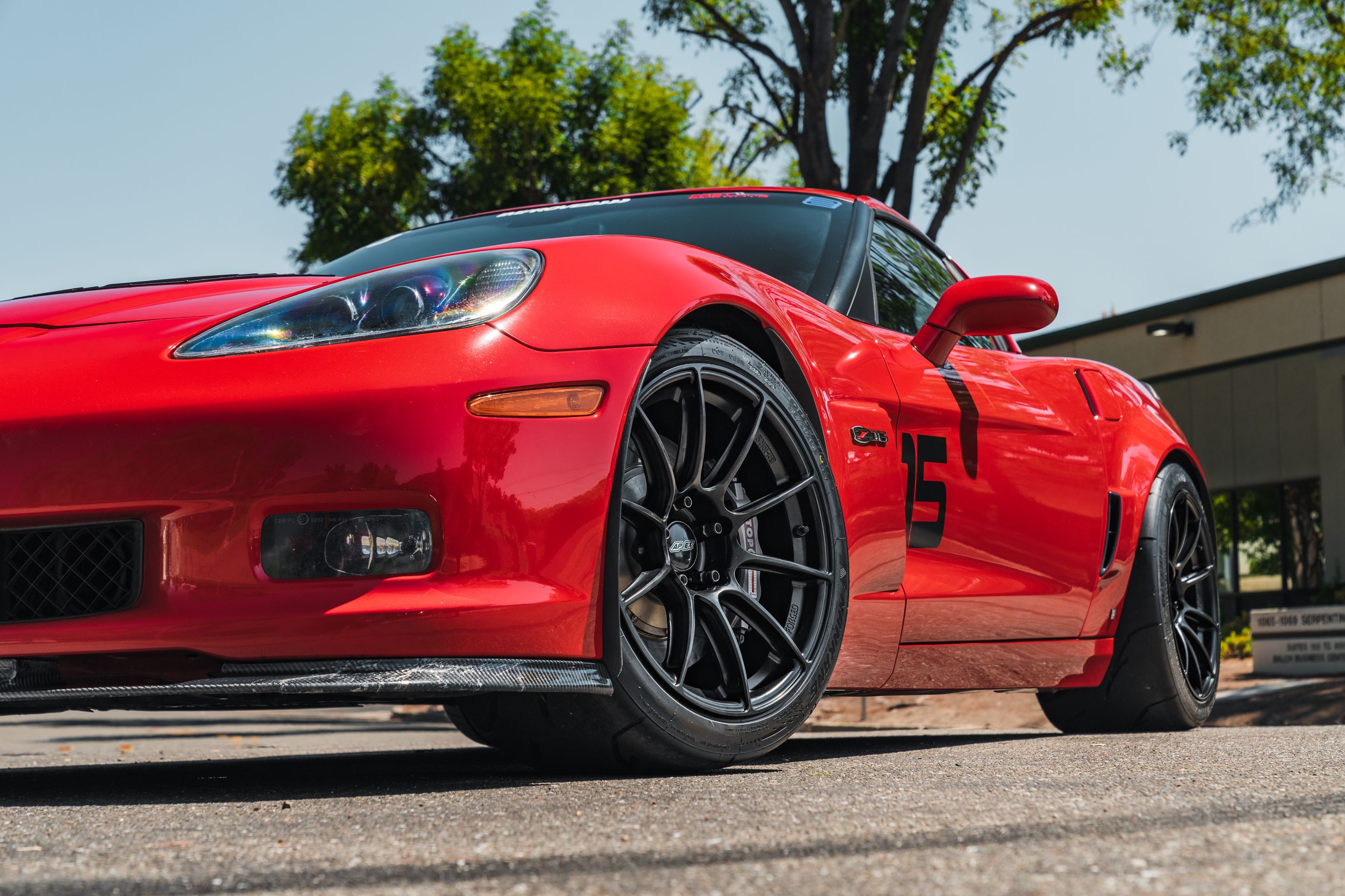 Red Chevrolet C6 Corvette Z06 with 18" SM-10RS Apex wheels in Satin Black