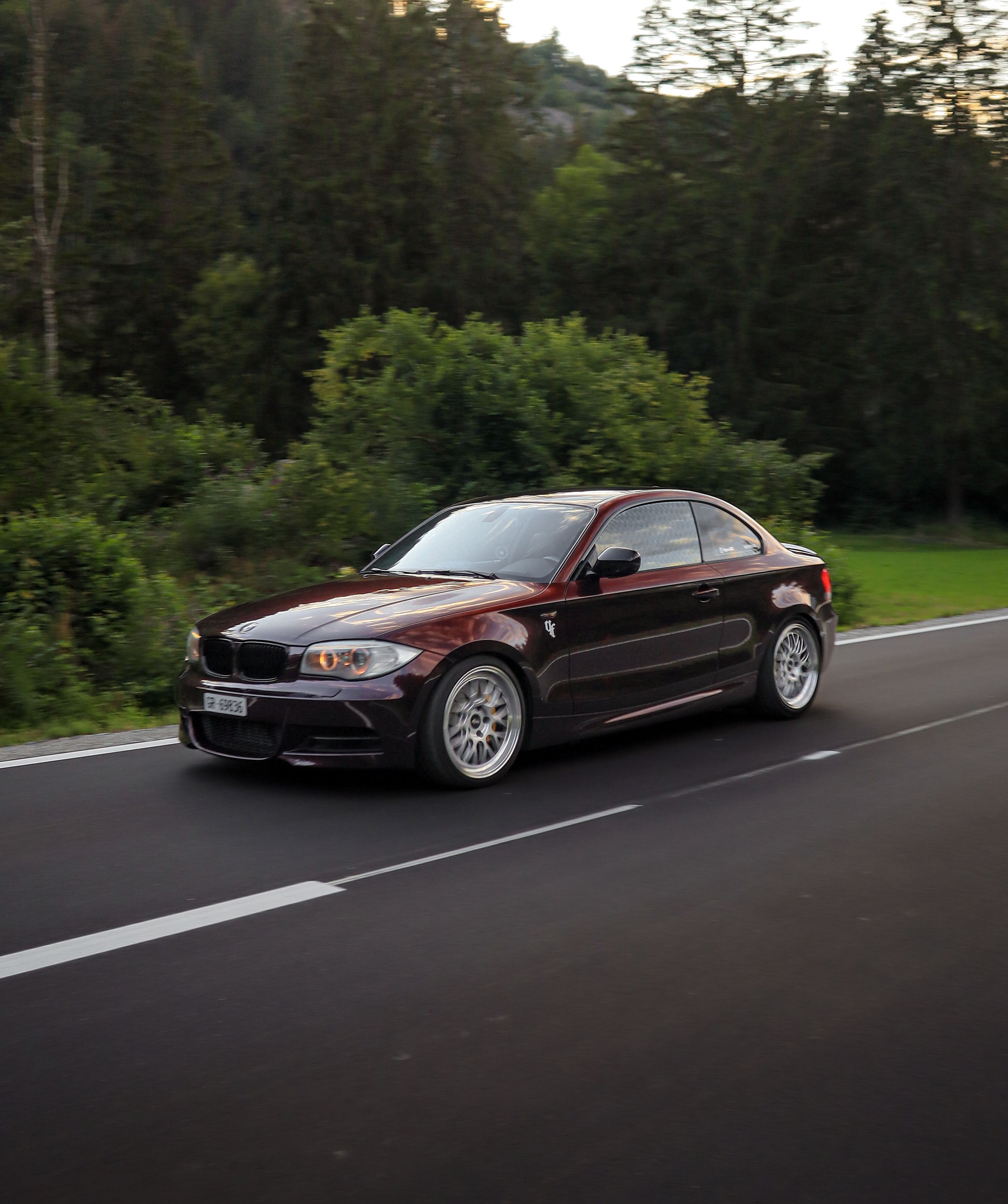 Red BMW E82 Coupe 1 Series with 18" ML-10RT Apex wheels in Machined Lip Race Silver