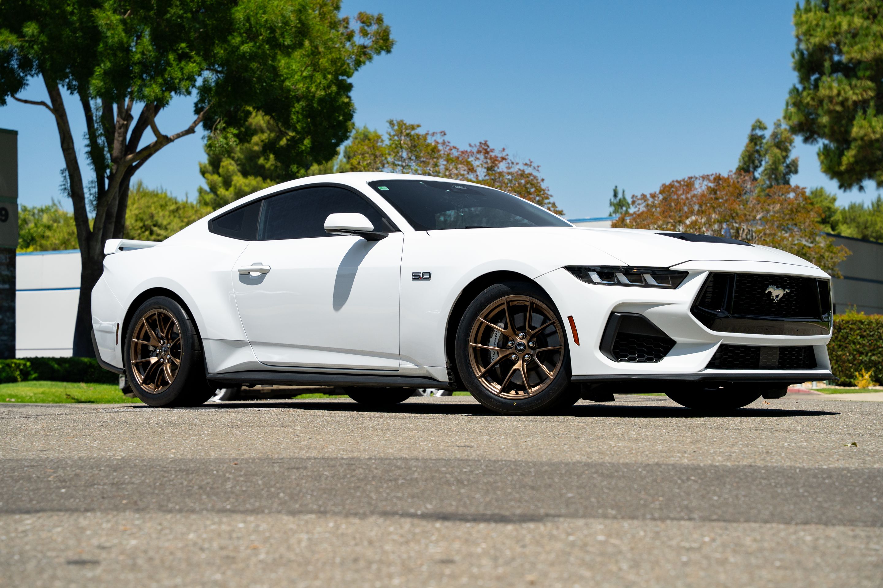 White Ford S650 Mustang GT with 18" VS-5RS Apex wheels in Satin Bronze