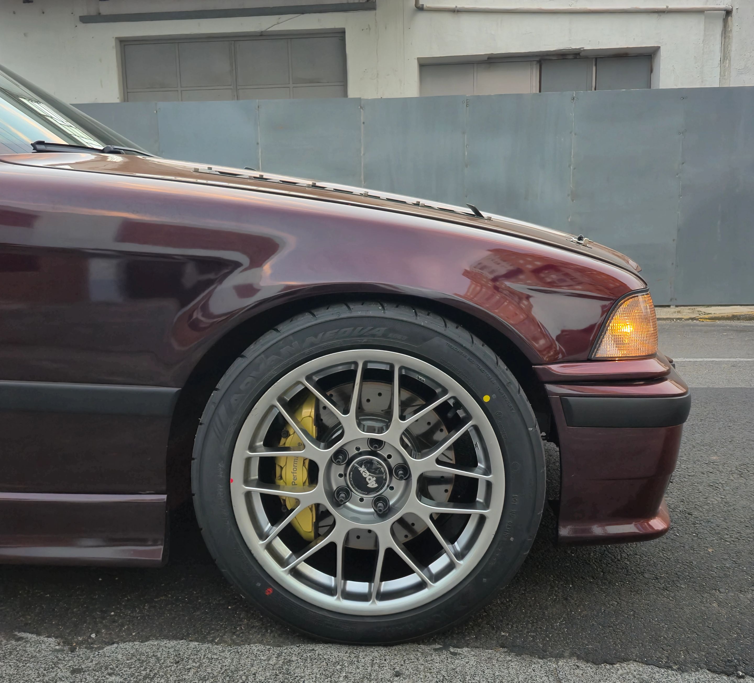 Red BMW E36 3 Series with 17" ARC-8 Apex wheels in Hyper Black