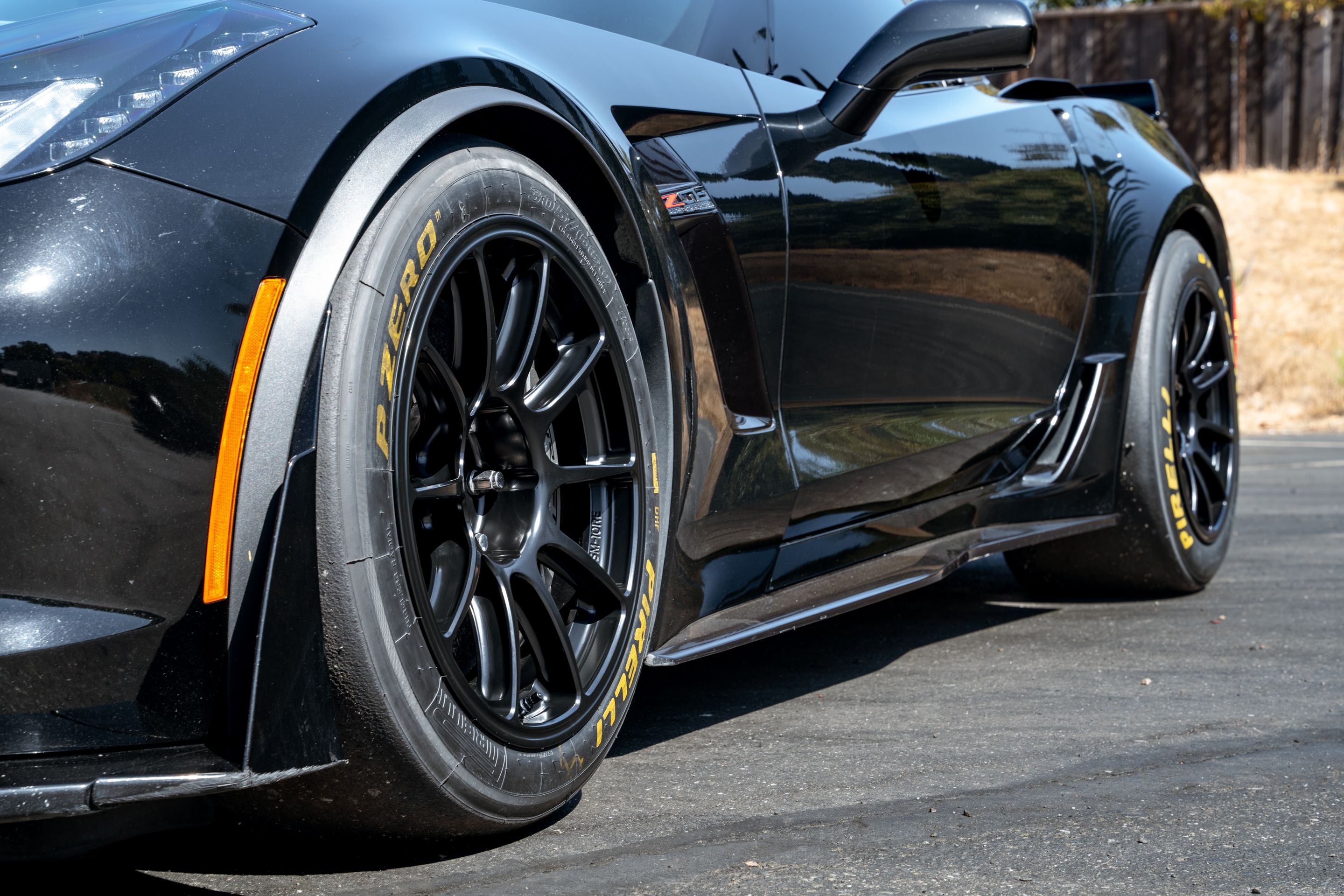 Black Chevrolet C7 Corvette Z06 with 18" SM-10RE Apex wheels in Satin Black
