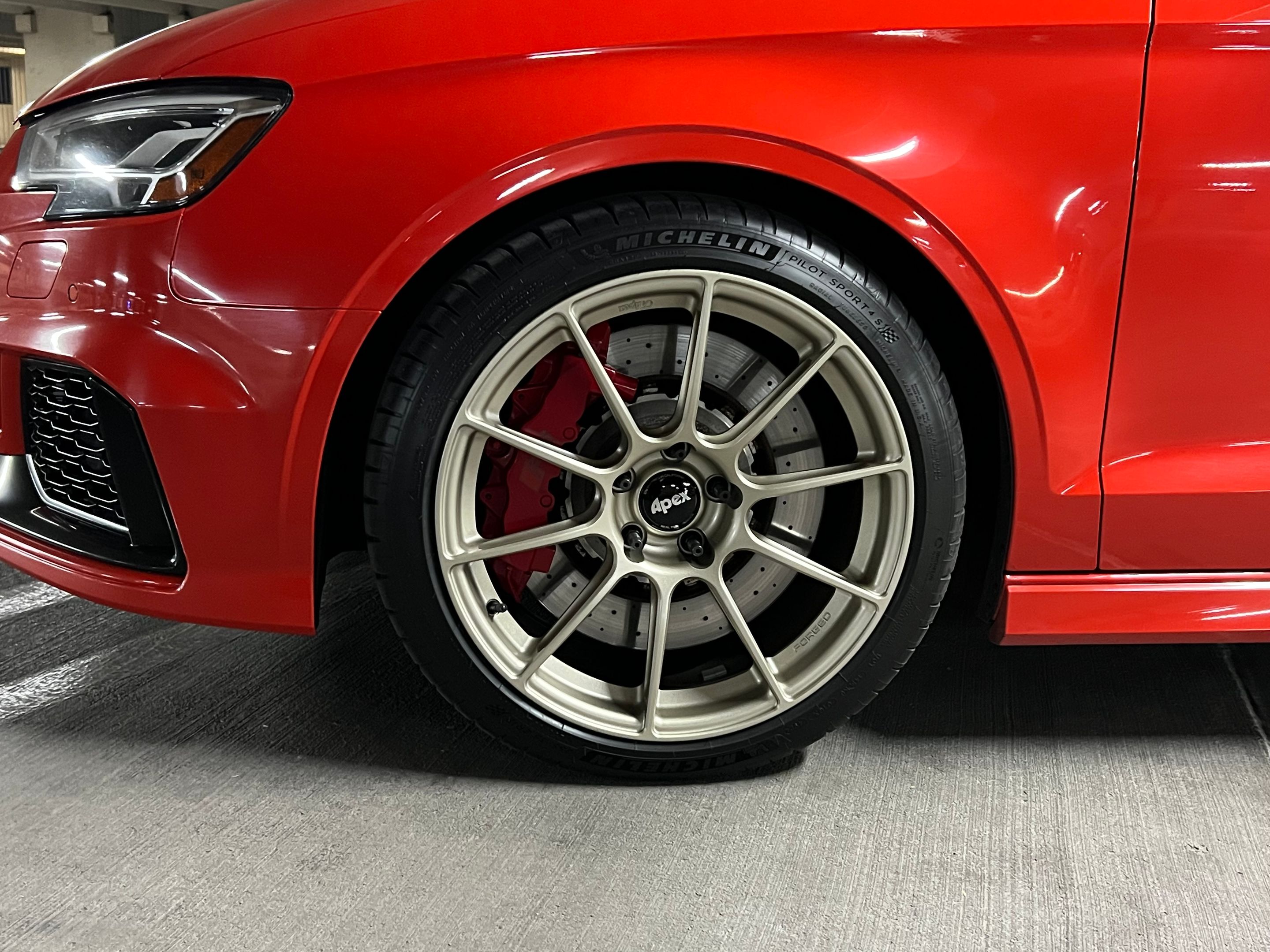 Red Audi 8V RS 3 with 18" SM-10RS Apex wheels in Motorsport Gold