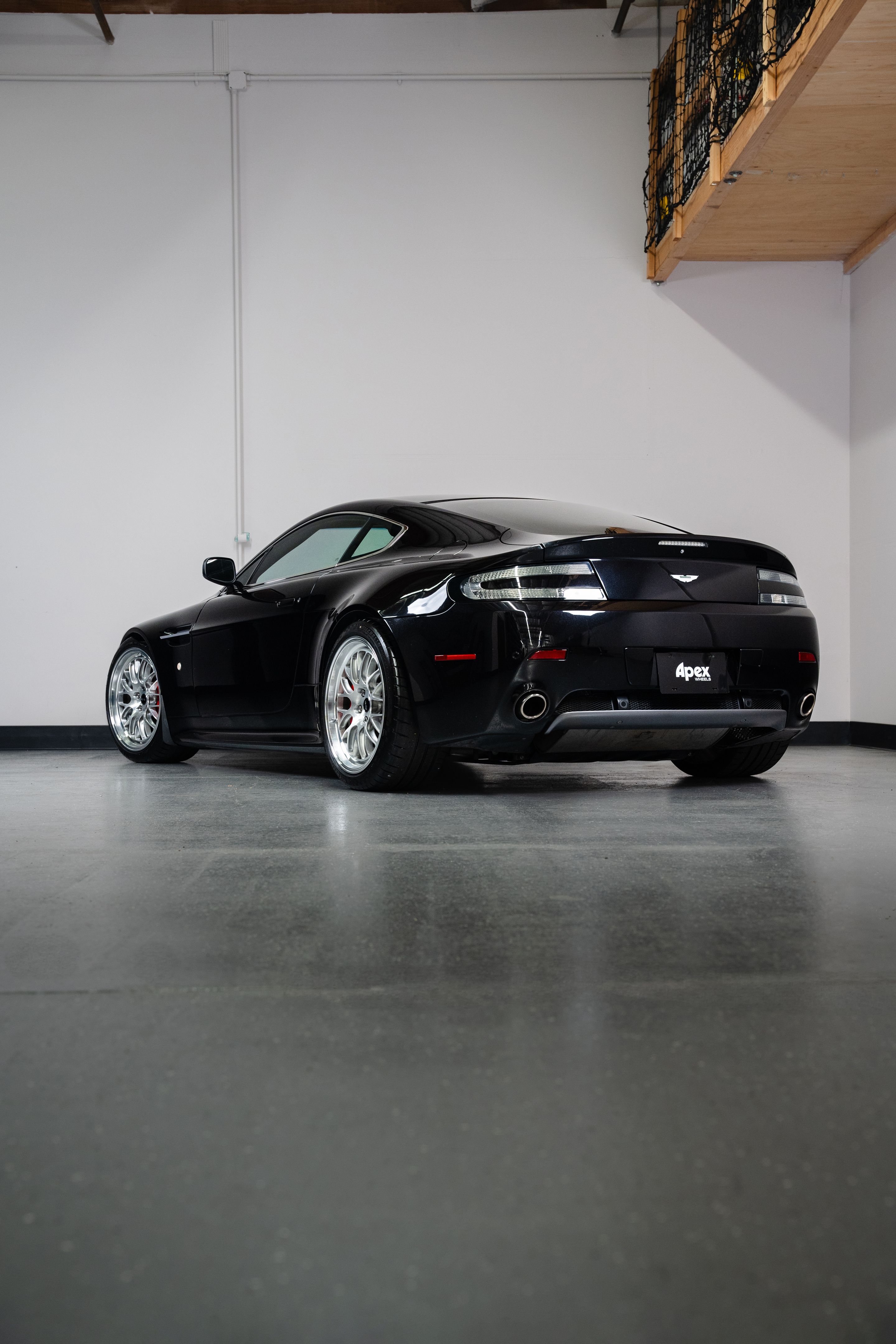 Black Aston Martin V8/V12 Vantage with 19" ML-10RT Apex wheels in Machined Lip Brushed Clear