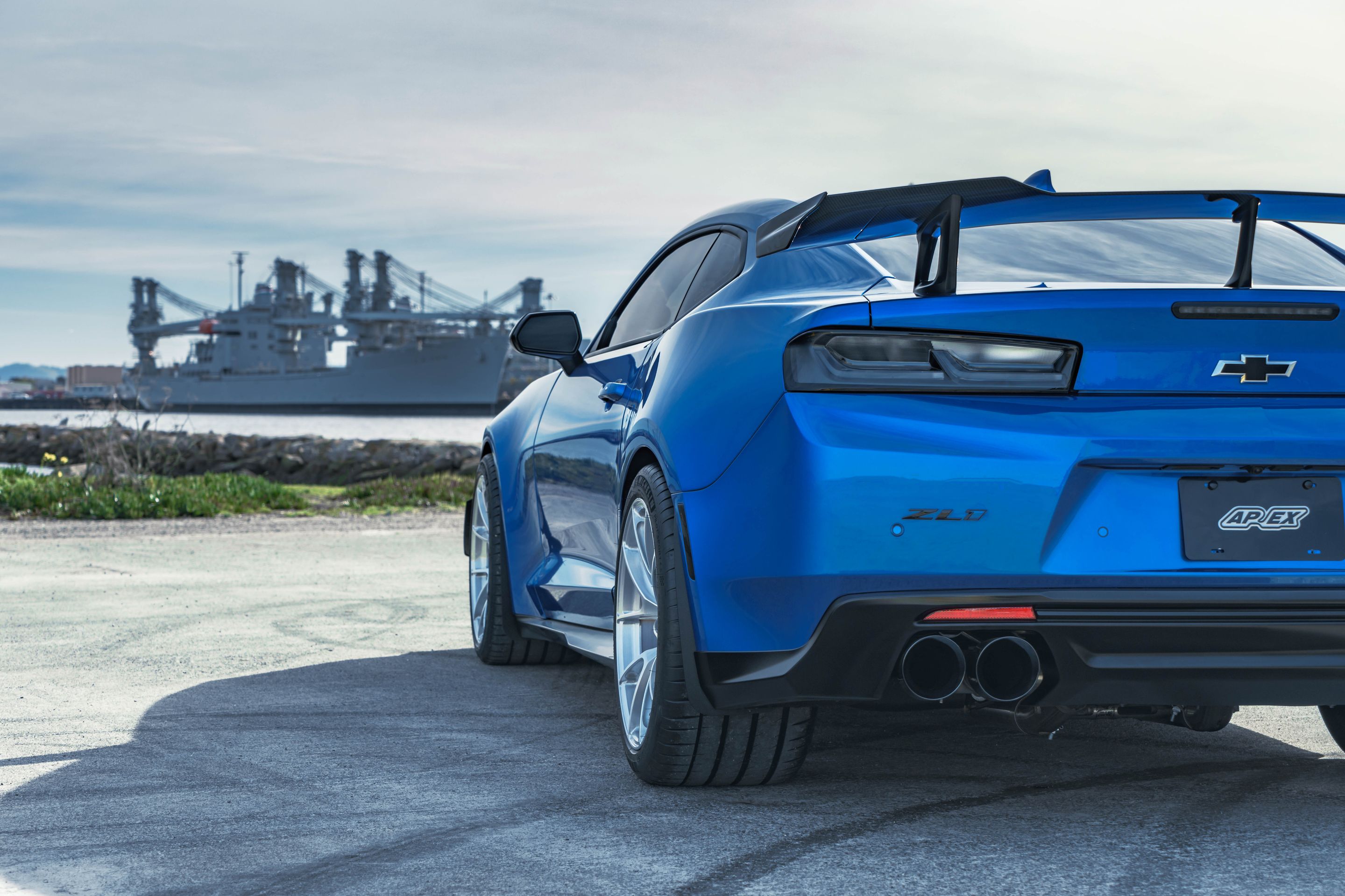 Blue Chevrolet 6th Gen Camaro ZL1 1LE with 19" VS-5RS Apex wheels in Brushed Clear
