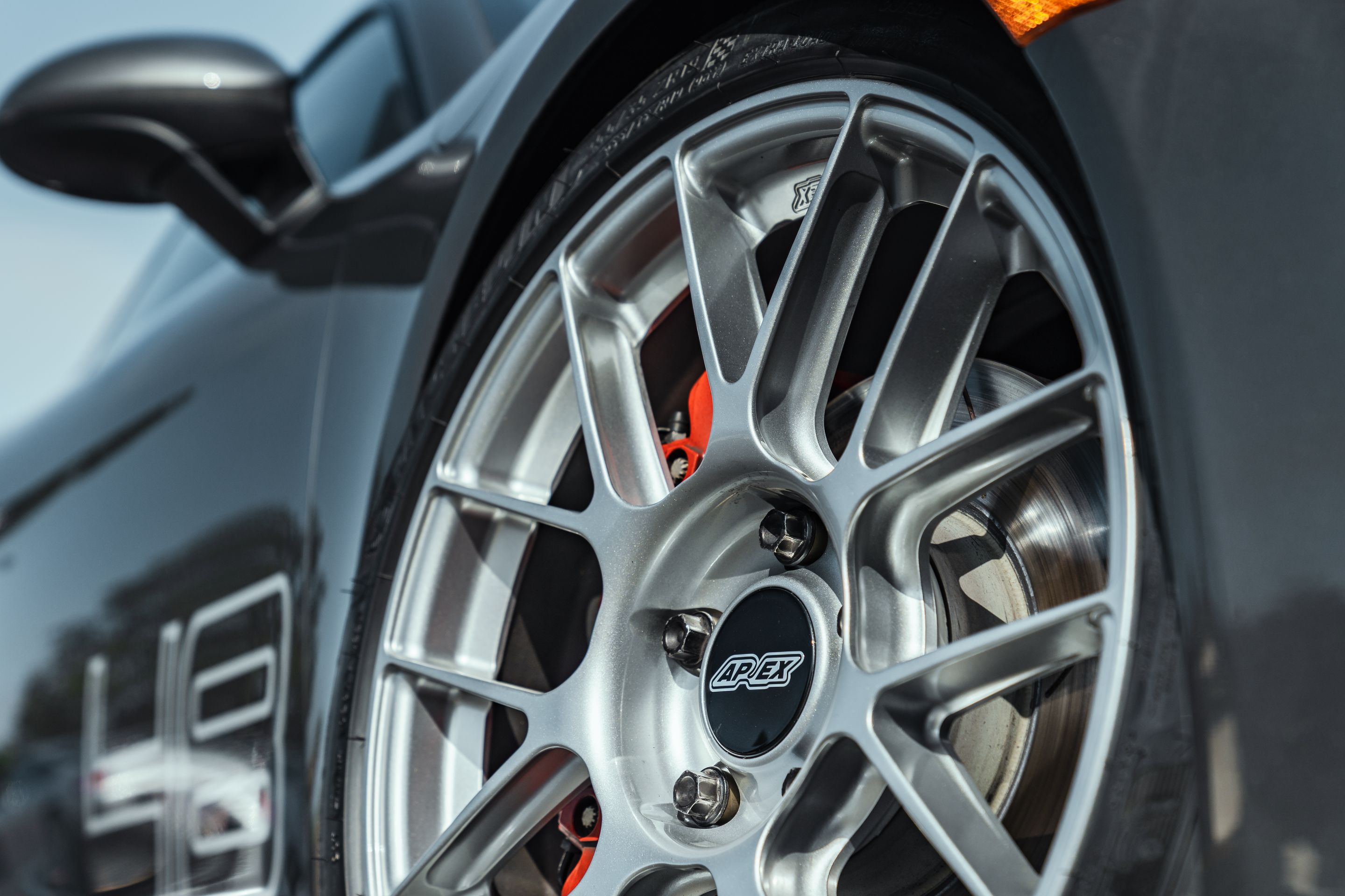 Grey Porsche 718 Cayman S with 19" EC-7RS Apex wheels in Race Silver