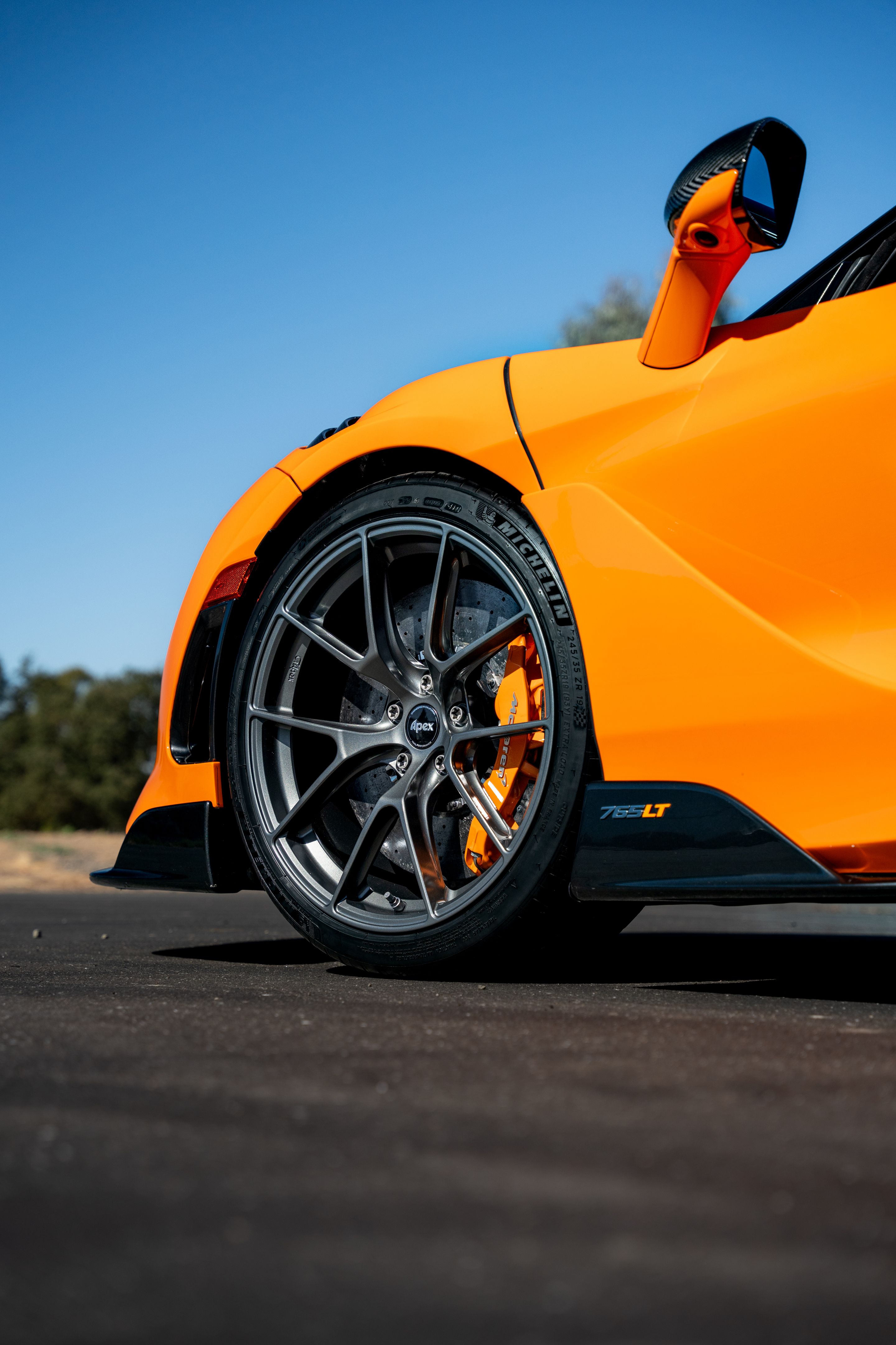 Orange McLaren 765LT with 19"/20" VS-5RS Apex wheels in Anthracite