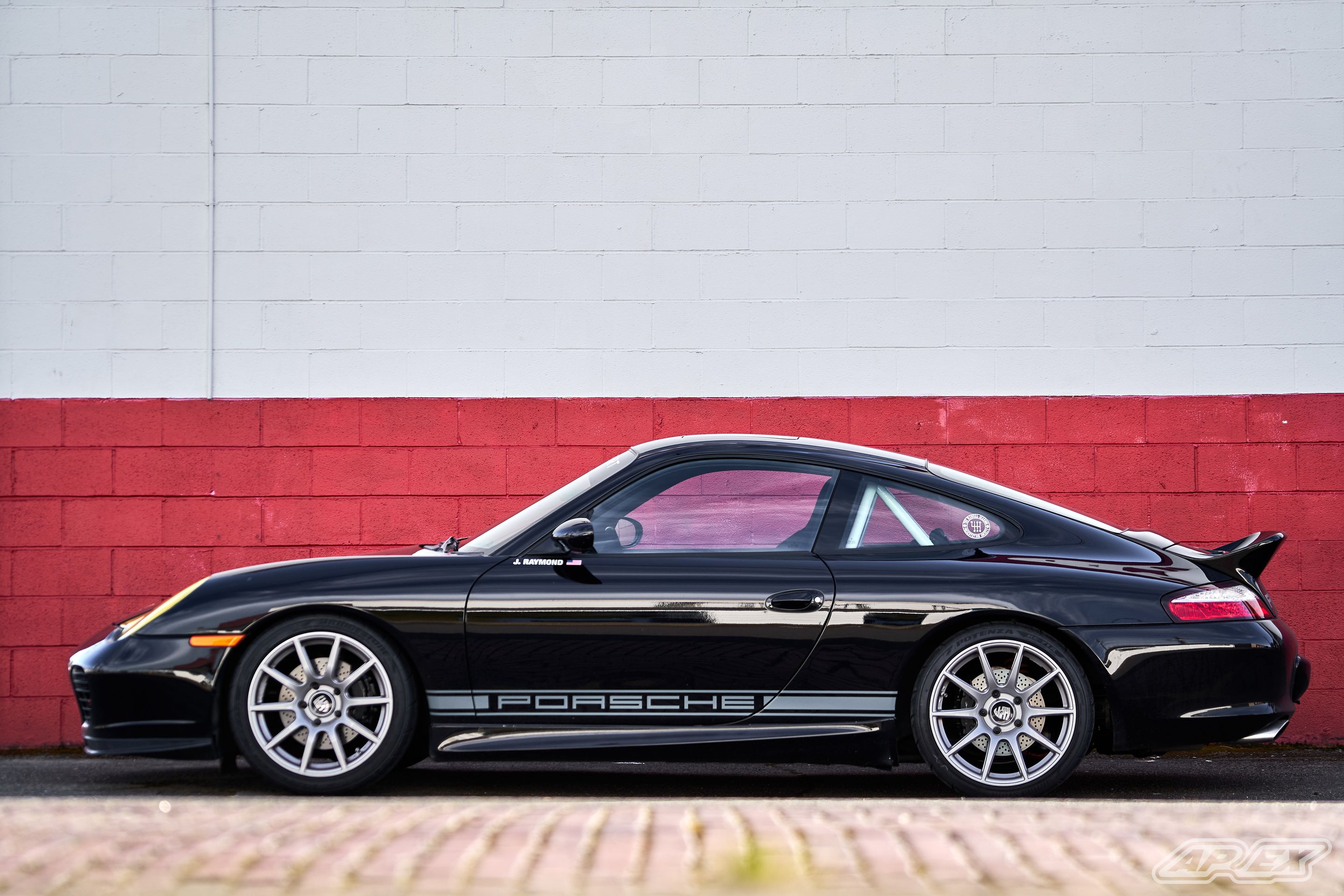 Black Porsche 911 996 Carrera with 18" SM-10 Apex wheels in Race Silver