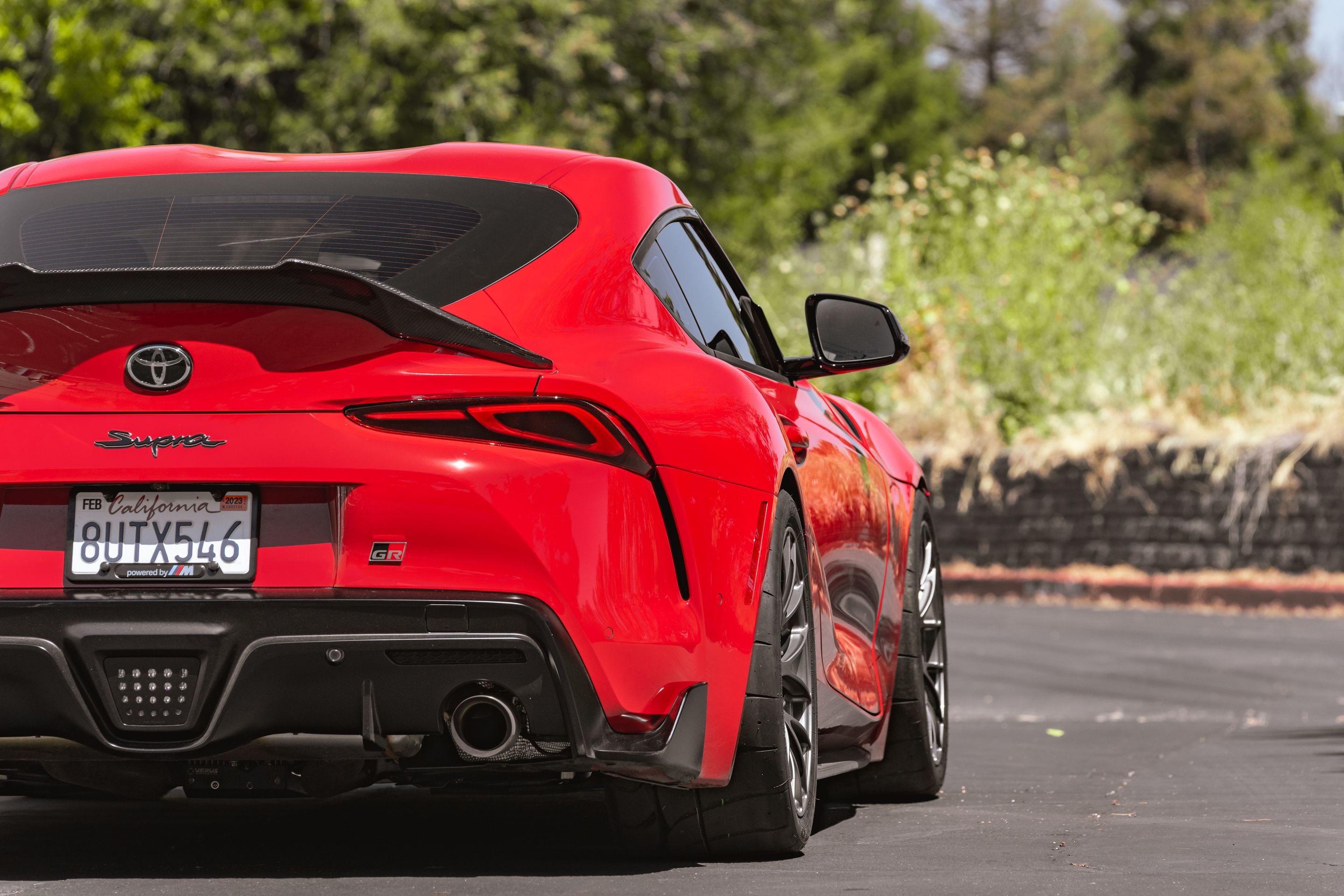 Red Toyota GR Supra with 18" EC-7RS Apex wheels in Anthracite