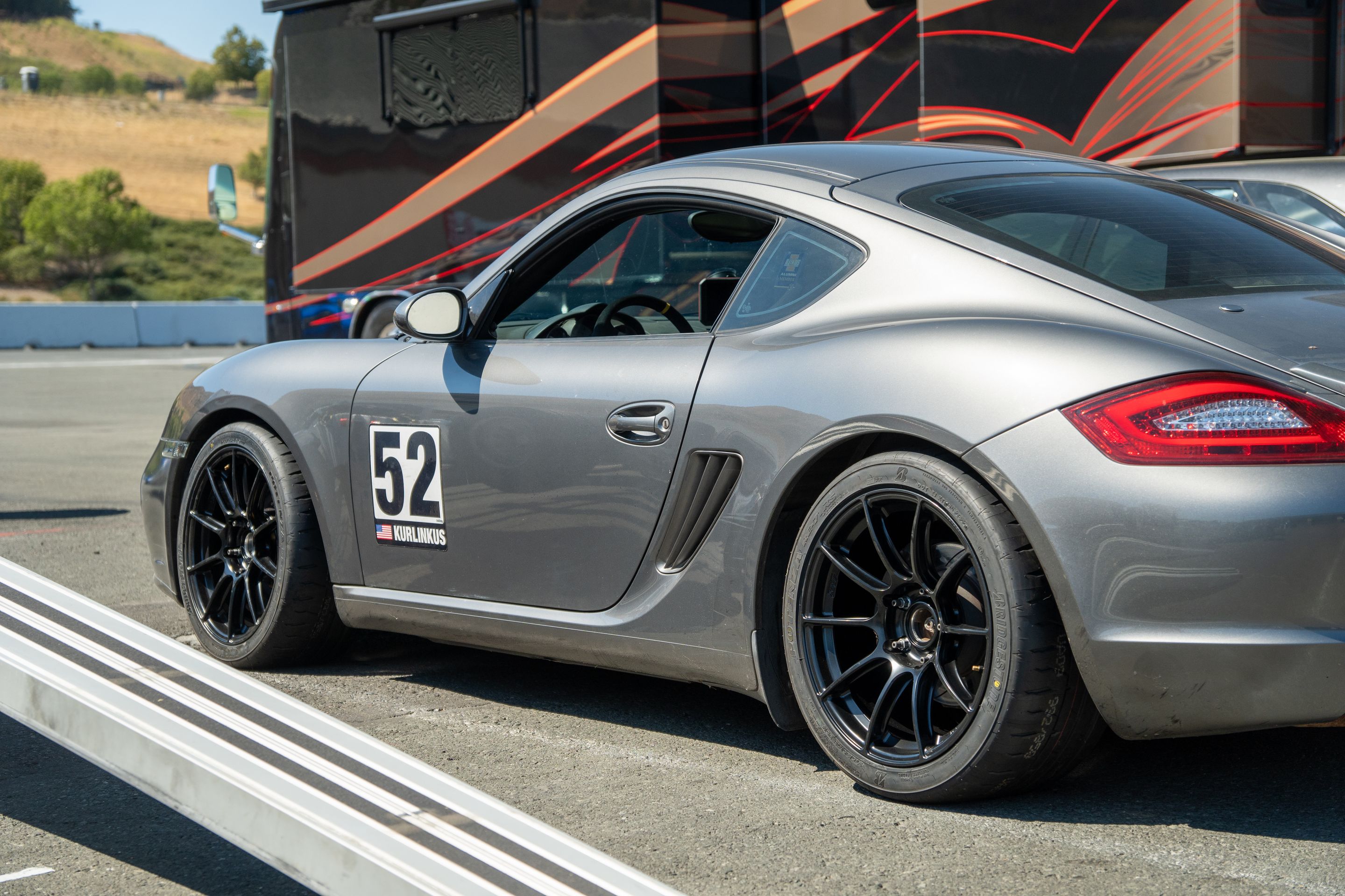 Grey Porsche 987 Cayman S with 18" SM-10RS Apex wheels in Satin Black