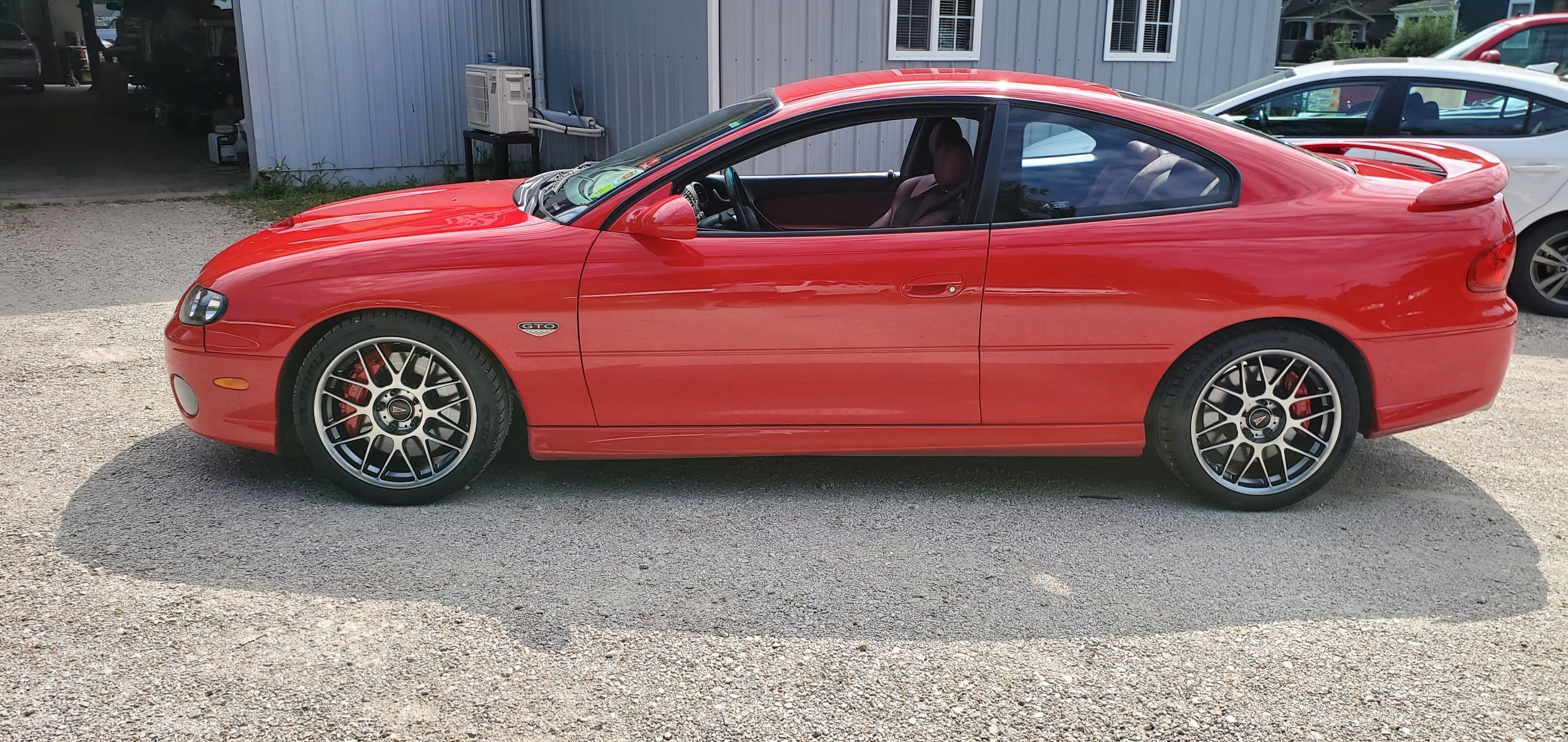 Red Pontiac 5th Gen GTO with 18" ARC-8 Apex wheels in Anthracite