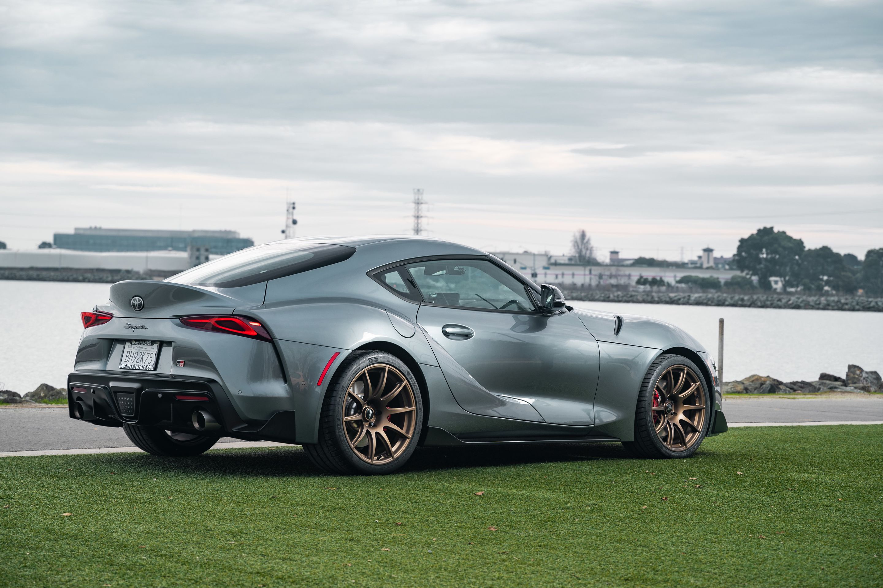 Grey Toyota GR Supra with 19" SM-10 Apex wheels in Satin Bronze