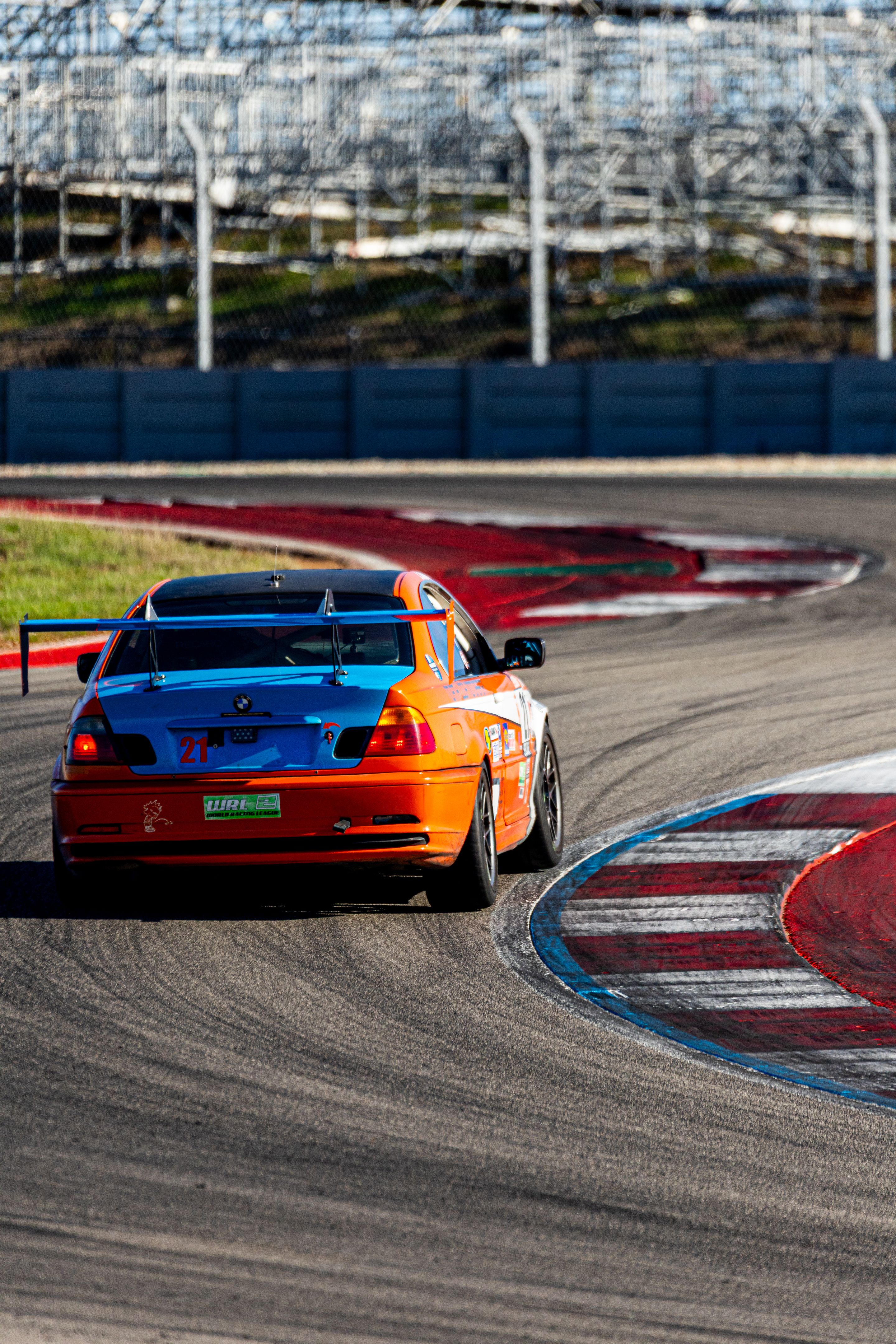 Orange BMW Spec E46 with 17" ARC-8 Apex wheels in Hyper Black
