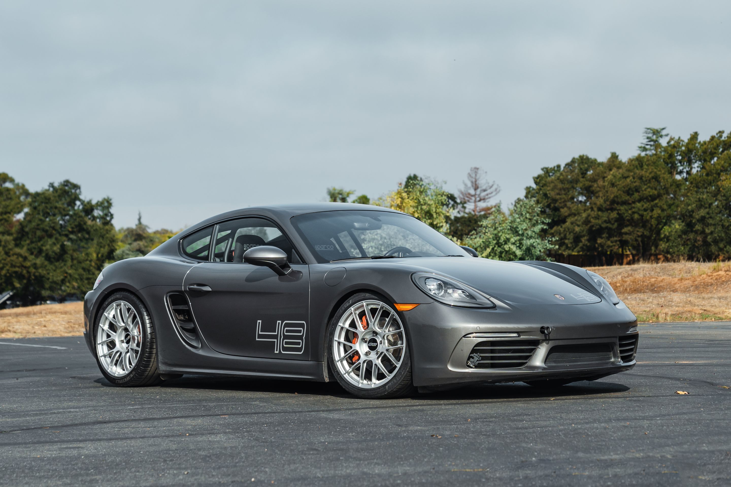 Grey Porsche 718 Cayman S with 19" EC-7RS Apex wheels in Race Silver