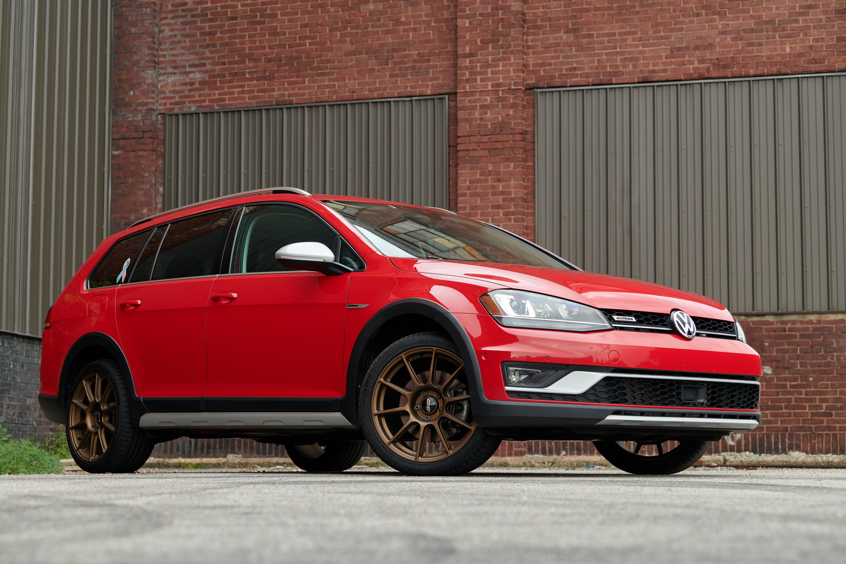 Red VW MK7 Alltrack/SportWagen Alltrack with 18" SM-10 Apex wheels in Satin Bronze