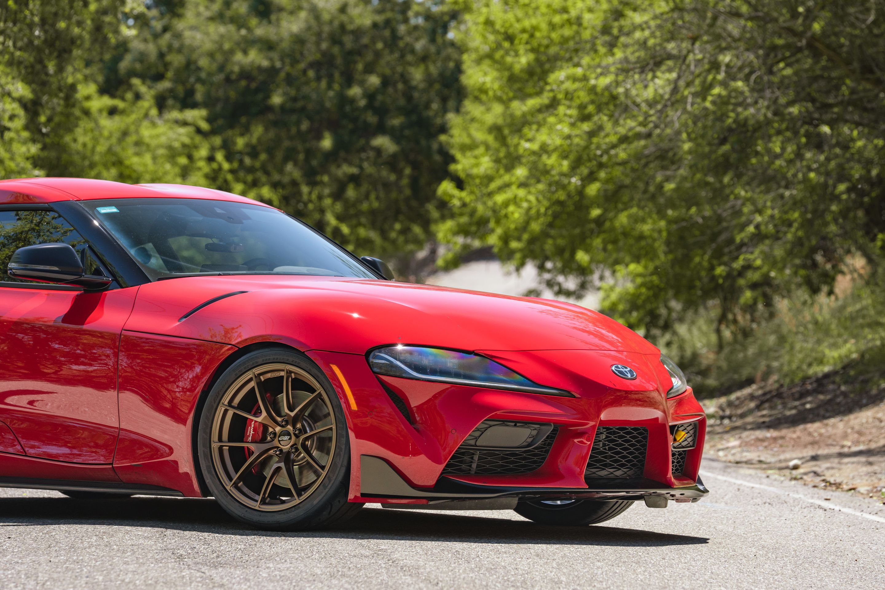 Red Toyota GR Supra with 19" VS-5RS Apex wheels in Satin Bronze