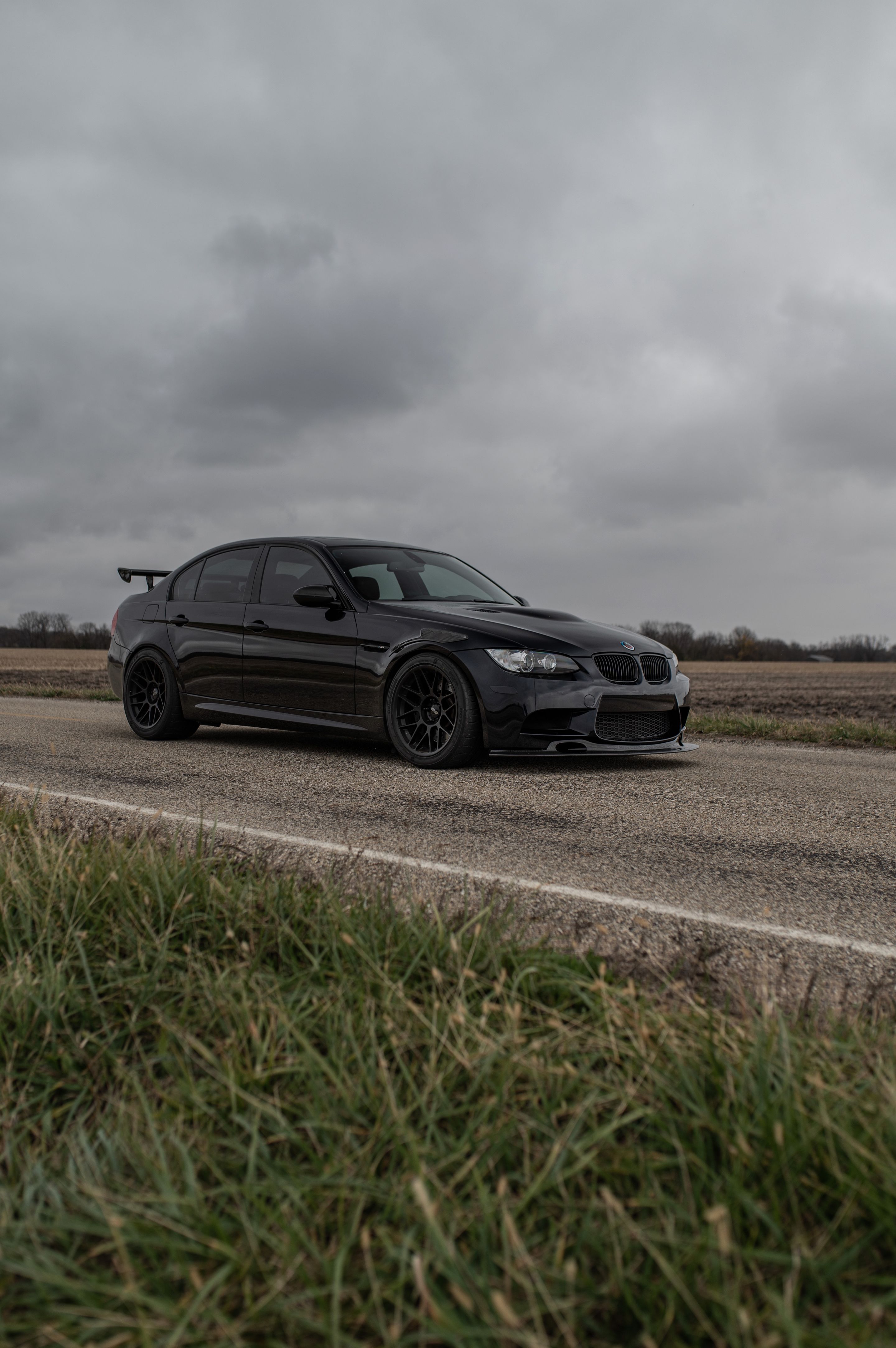 Black BMW E90 Sedan M3 with 18" ARC-8 Apex wheels in Satin Black