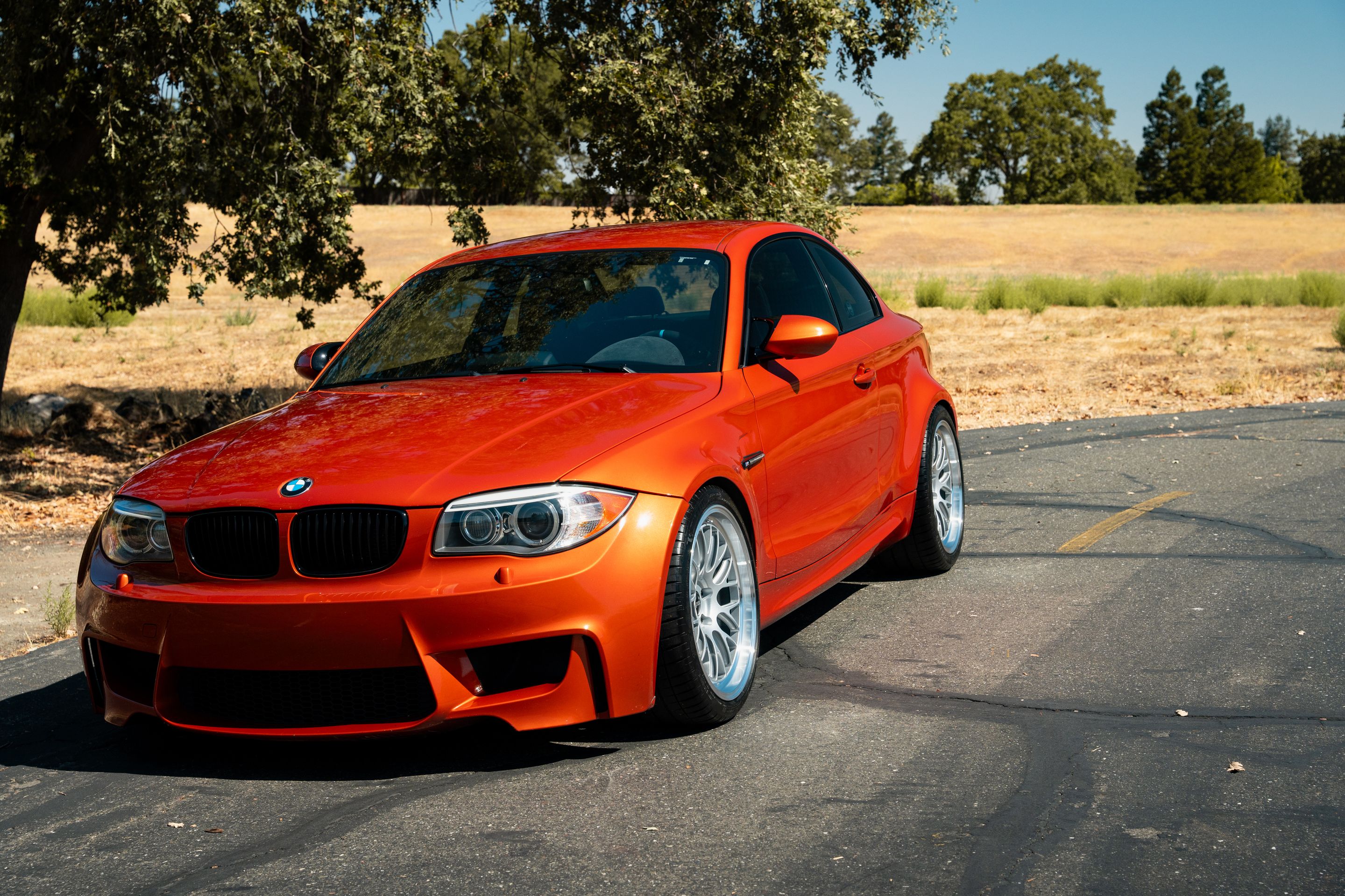Orange BMW E82 1M with 19" ML-10RT Apex wheels in Machined Lip Race Silver