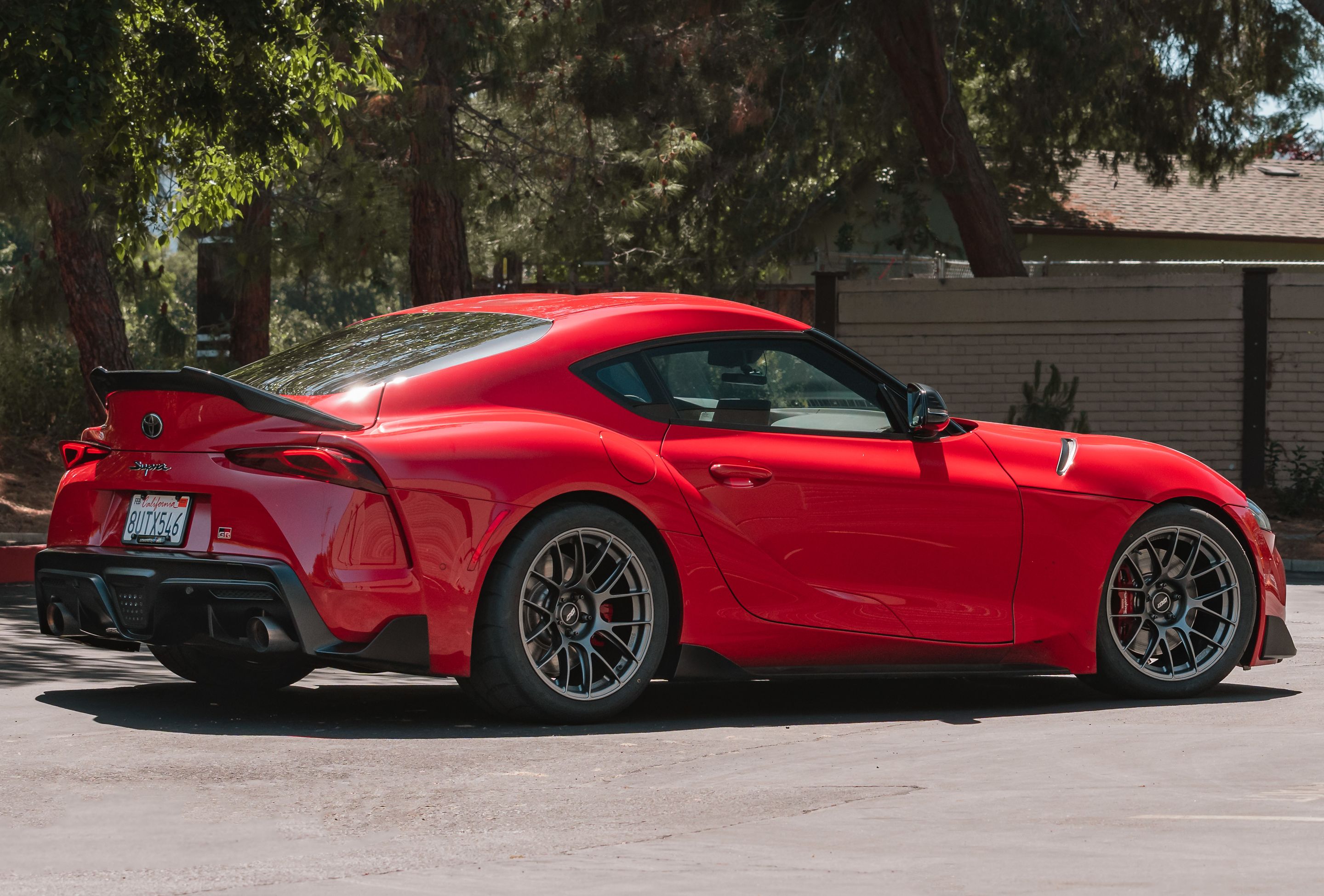 Red Toyota GR Supra with 18" EC-7RS Apex wheels in Anthracite