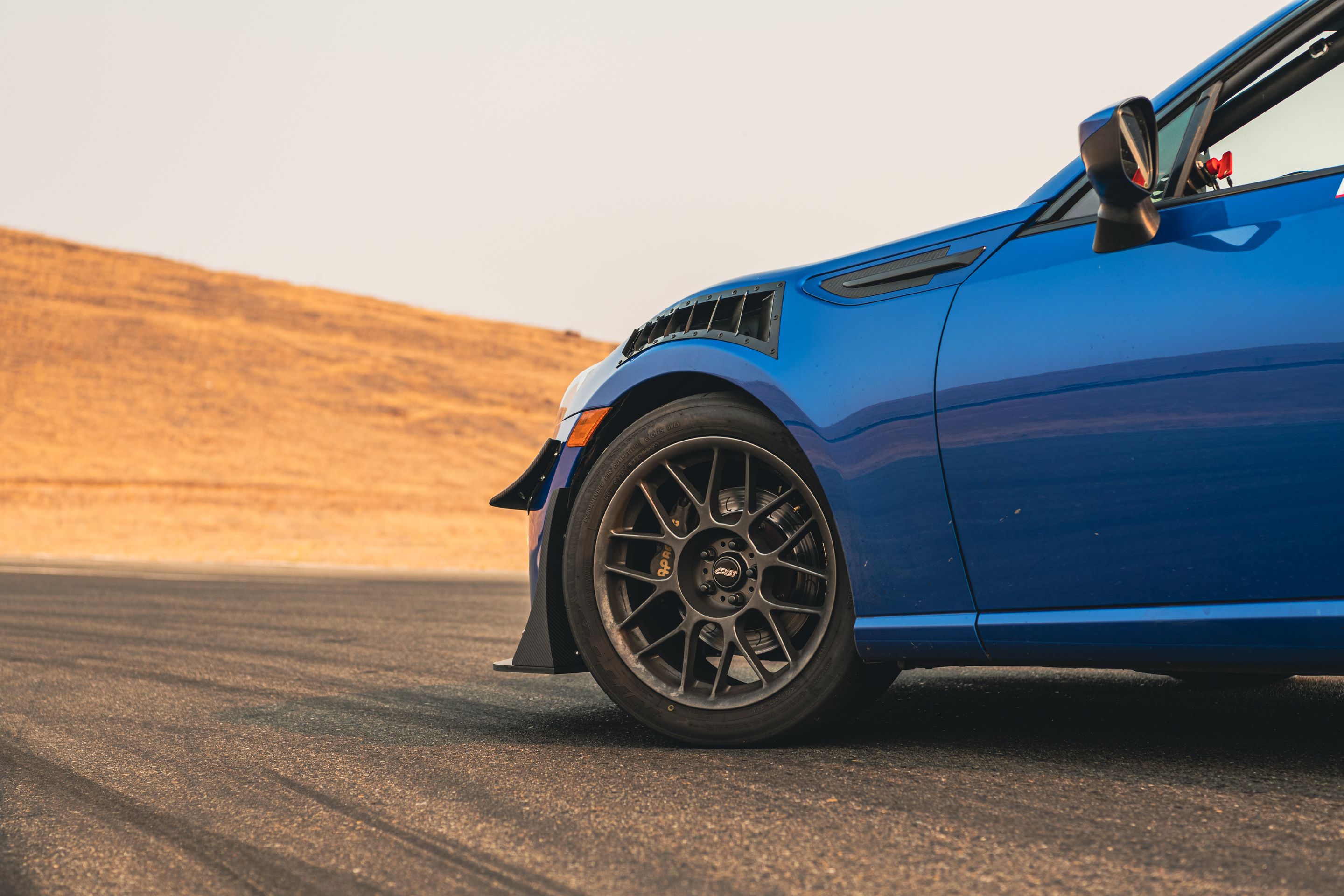 Blue Subaru ZC6 / Gen 1 BRZ with 17" ARC-8 Apex wheels in Anthracite