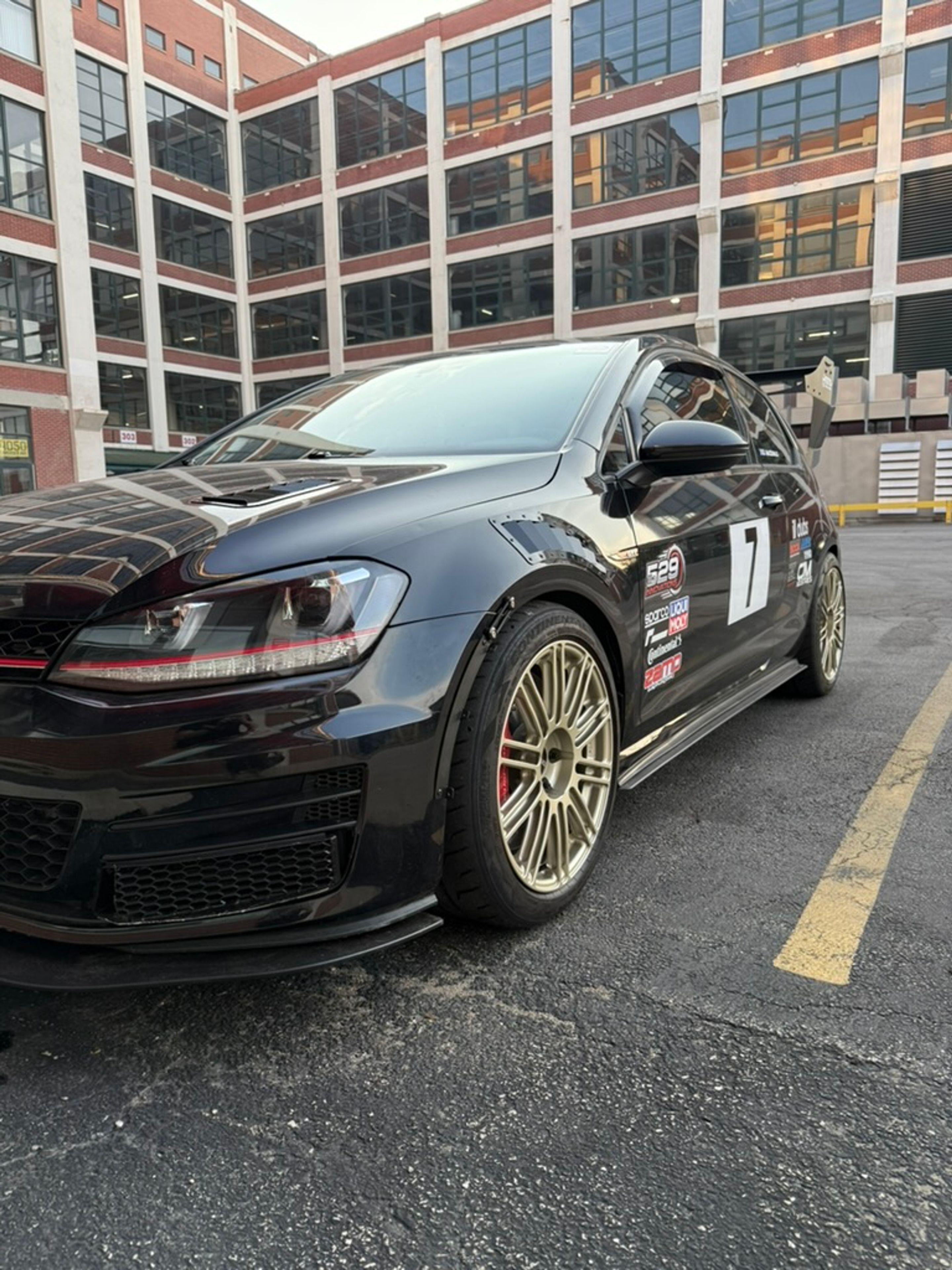 Black VW MK7 GTI with 18" TC-10RT Apex wheels in Motorsport Gold
