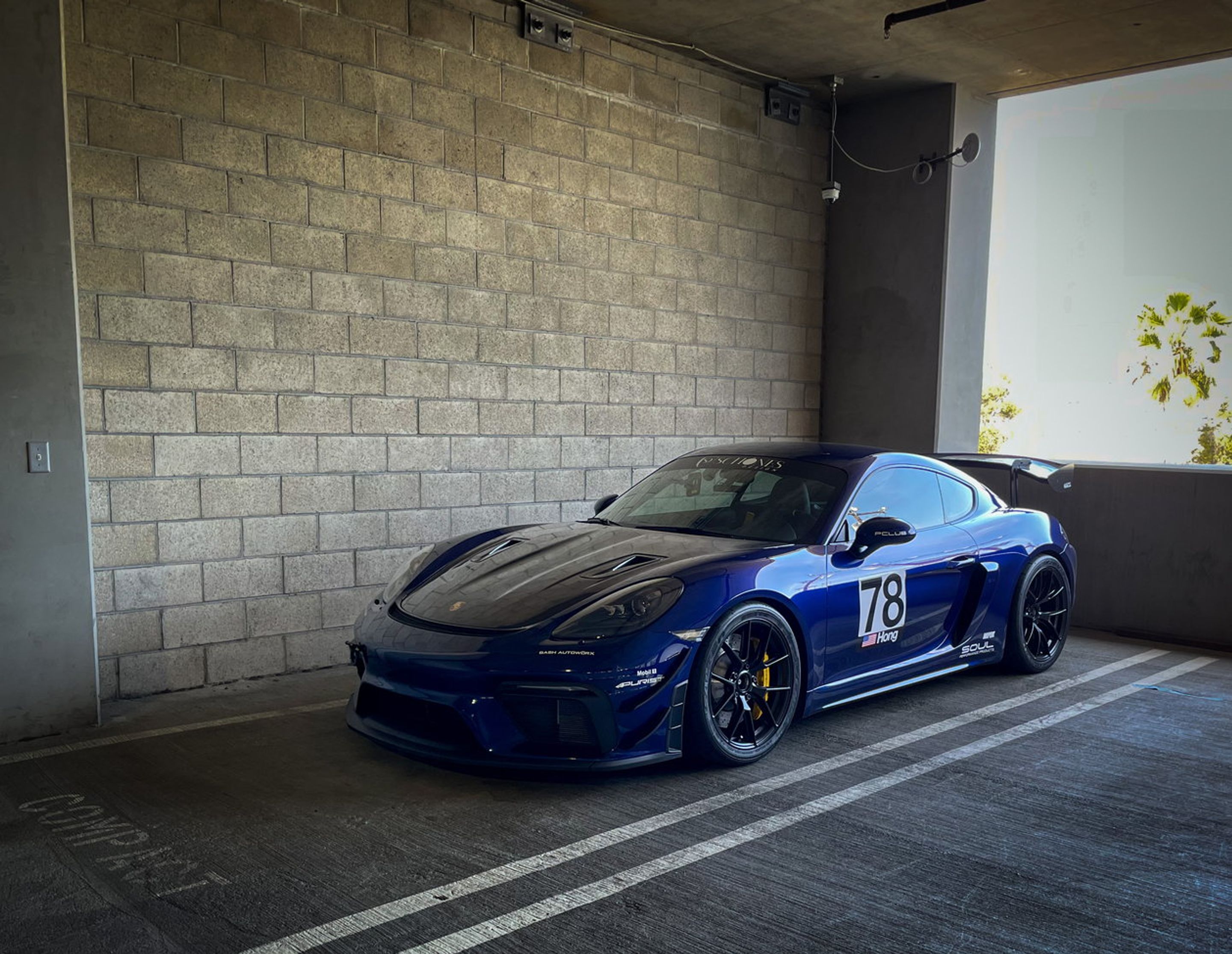 Blue Porsche 718 Cayman GT4 with 19" VS-5RS Apex wheels in Satin Black