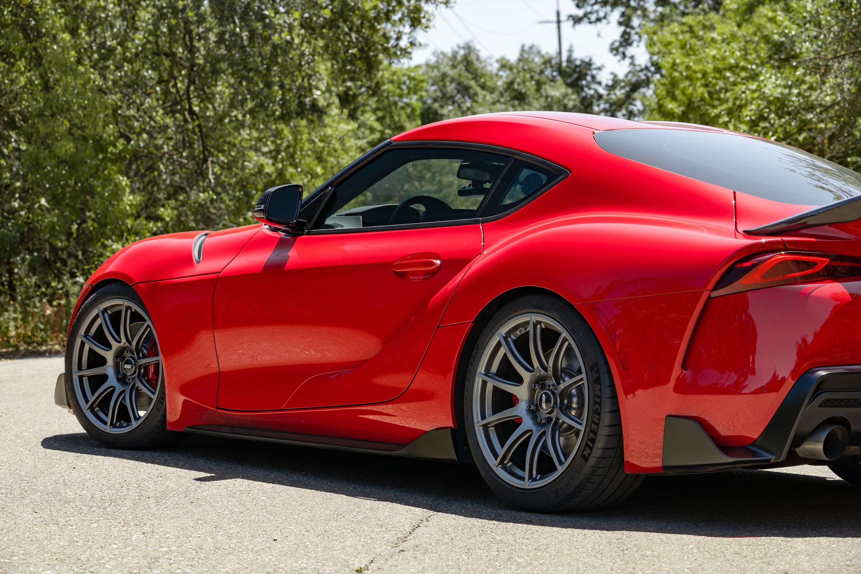 Red Toyota GR Supra with 19" SM-10 Apex wheels in Anthracite