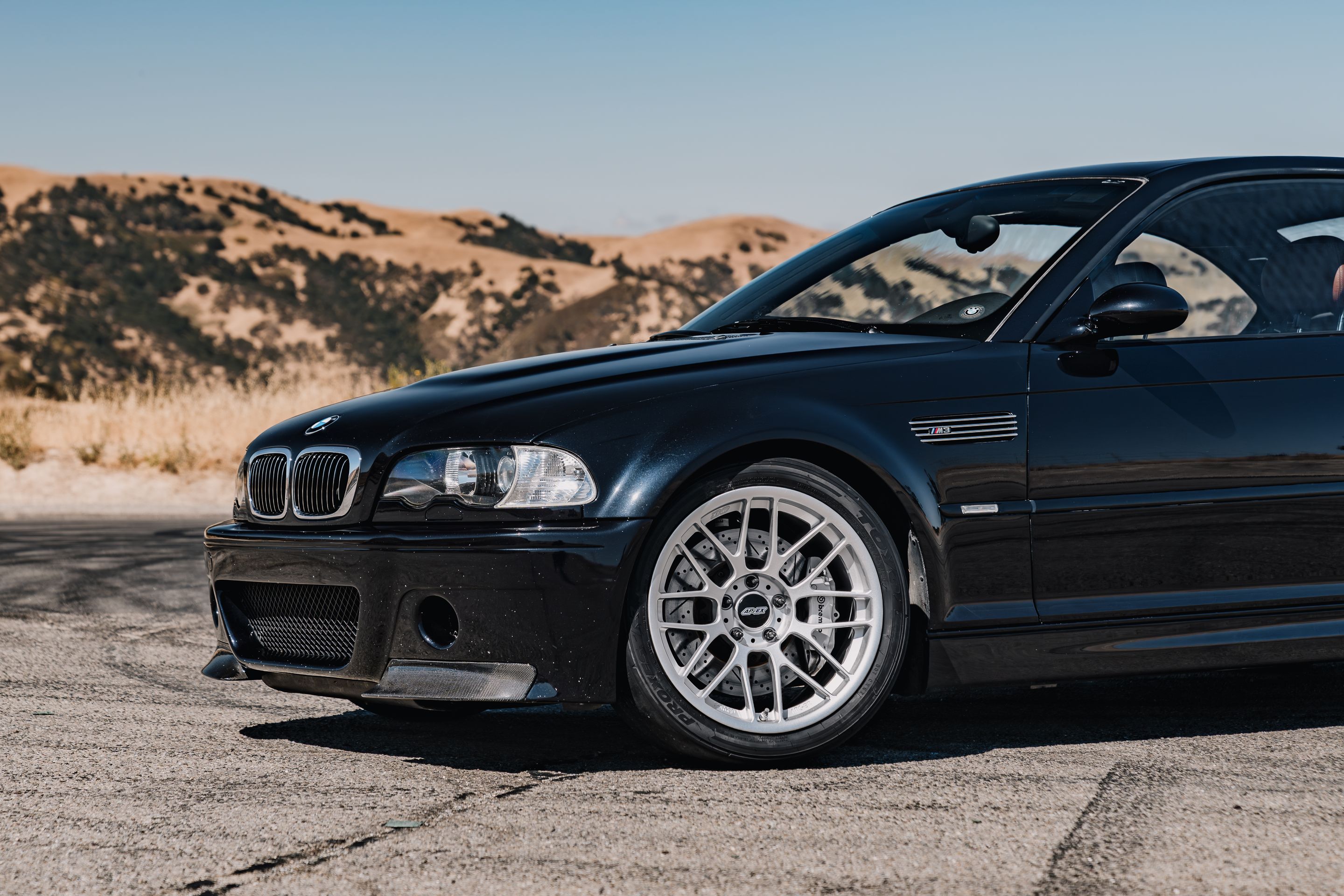 Black BMW E46 M3 with 18" ARC-8RT Apex wheels in Race Silver