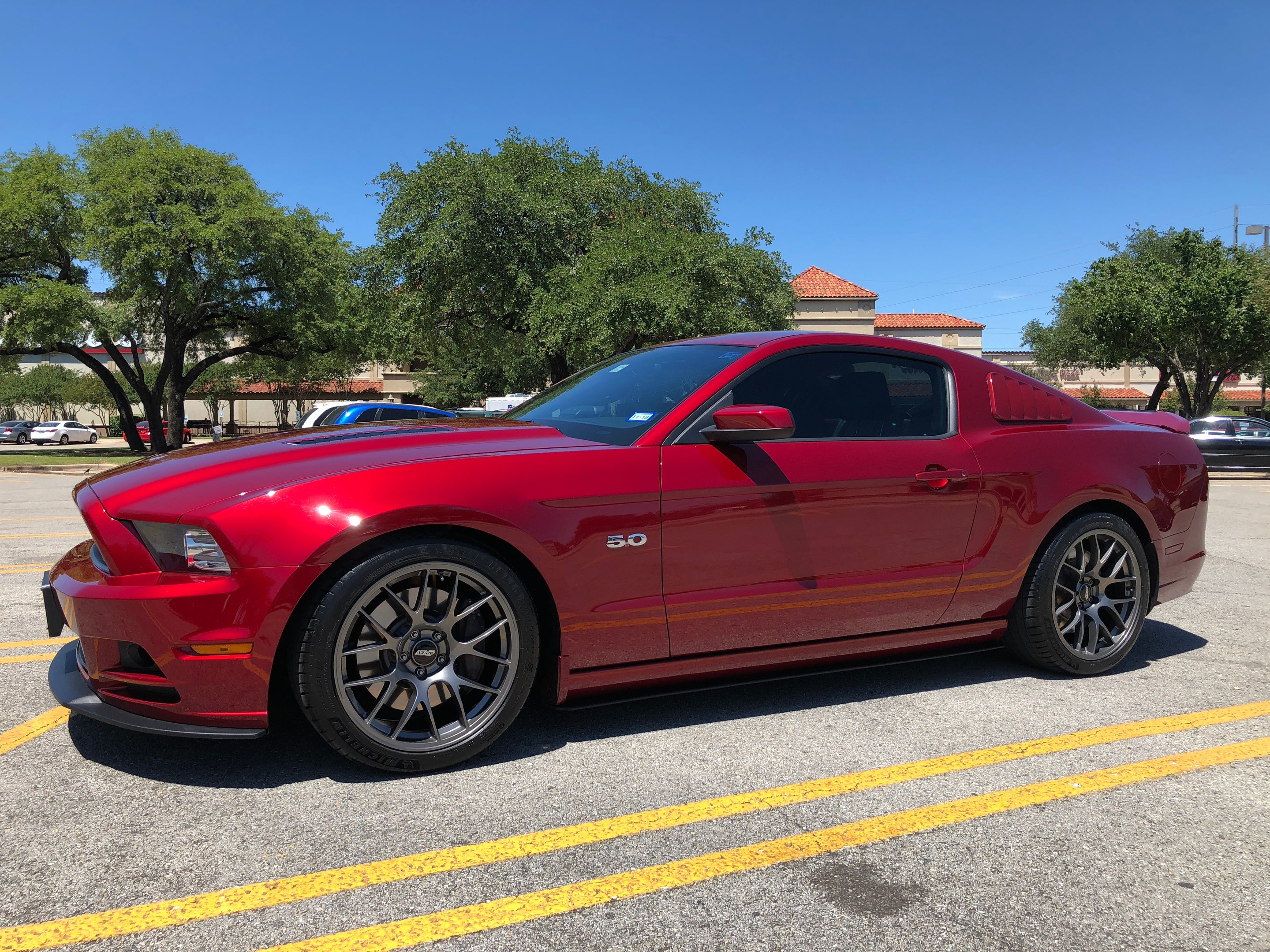 Red Ford S197 Mustang GT with 19" EC-7 Apex wheels in Anthracite