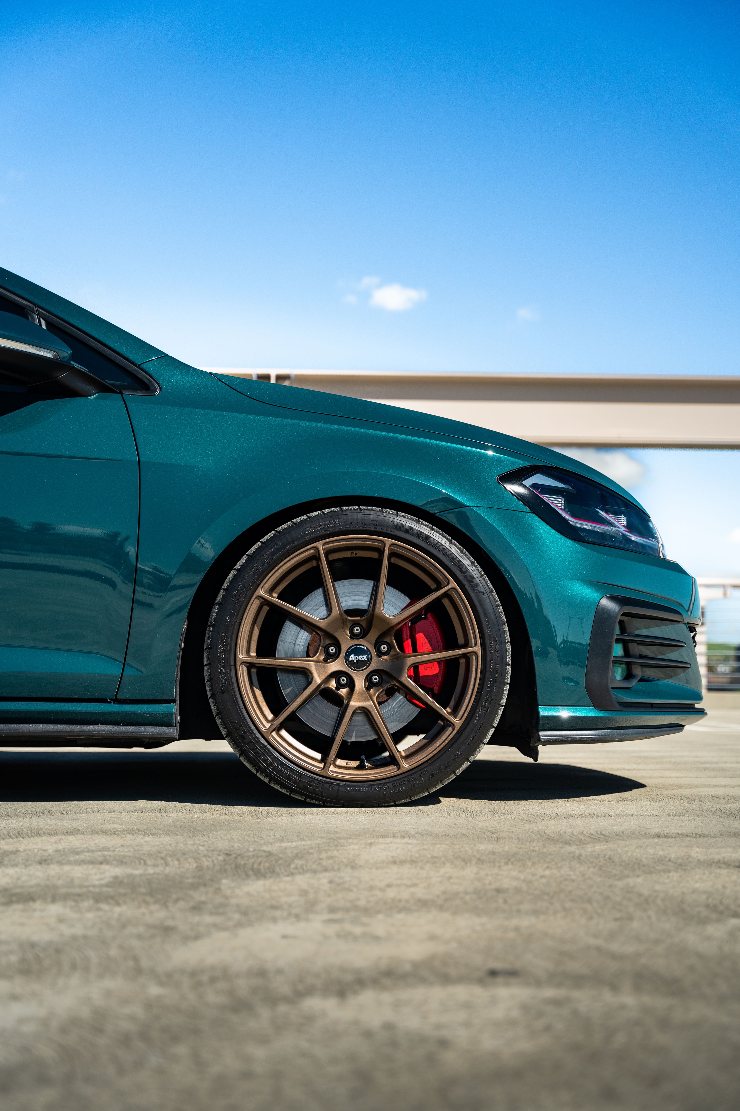 Green VW MK7 GTI with 18" VS-5 Apex wheels in Satin Bronze