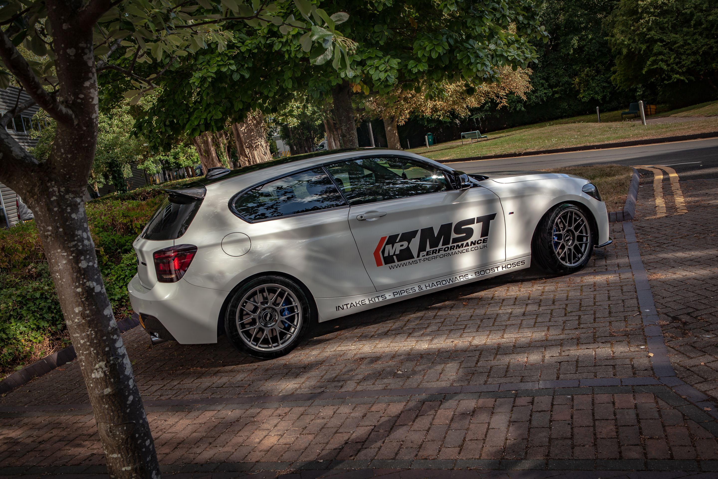 White BMW F21 3 Door Hatchback 1 Series with 18" ARC-8 Apex wheels in Anthracite