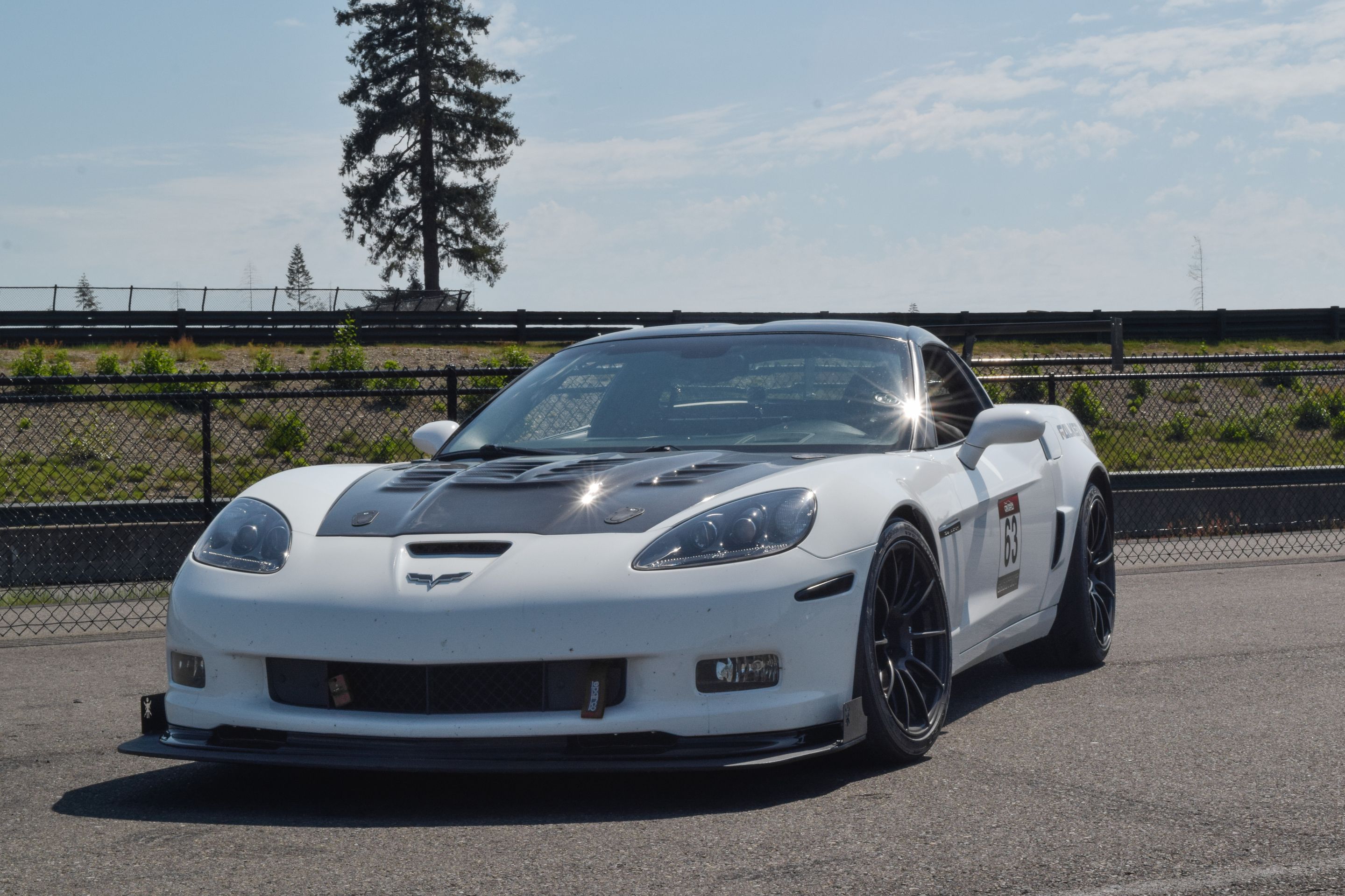 White Chevrolet C6 Corvette Grand Sport with 18"/19" SM-10RS Apex wheels in Satin Black