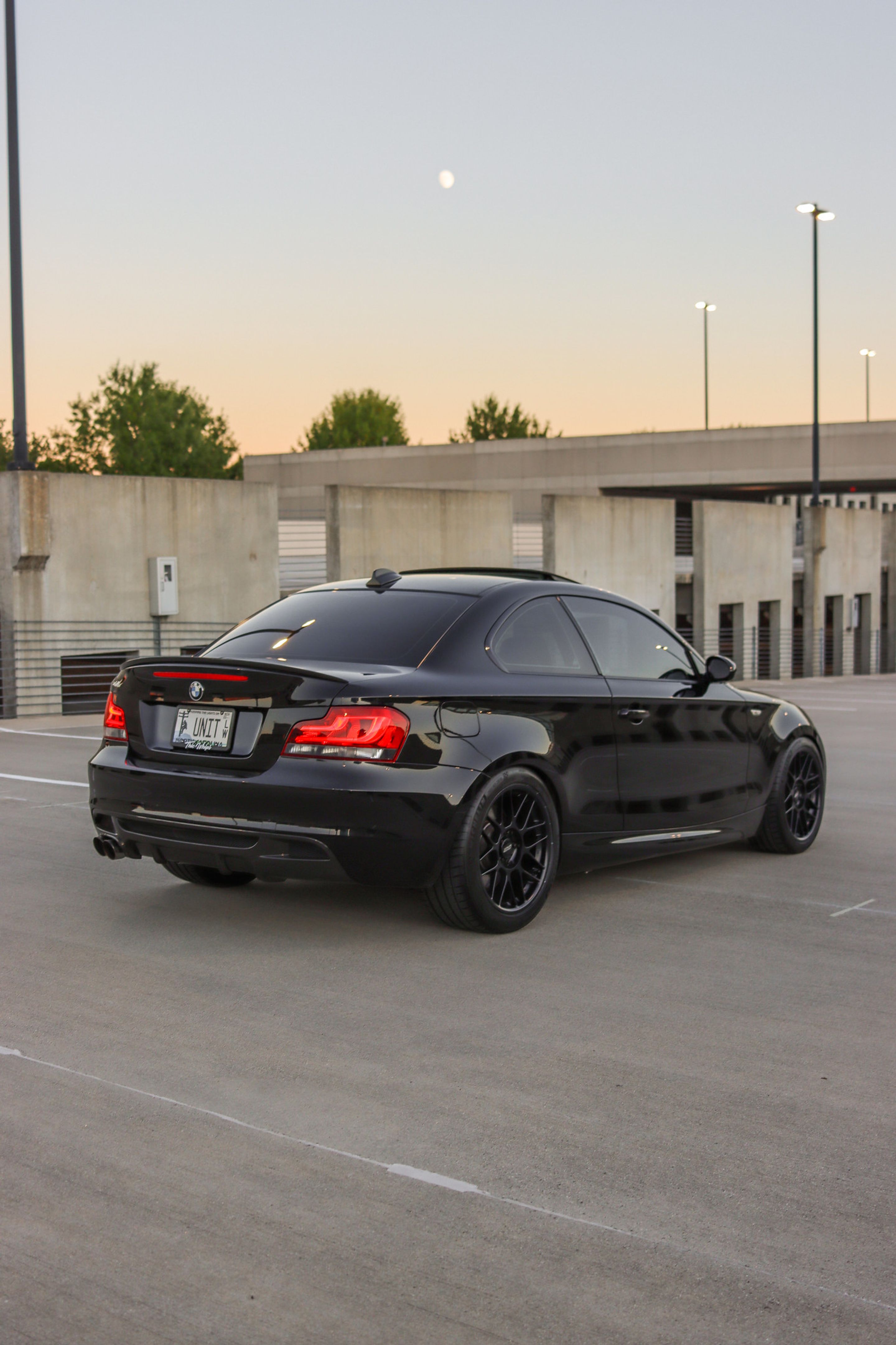 Black BMW E82 Coupe 1 Series with 18" ARC-8 Apex wheels in Satin Black