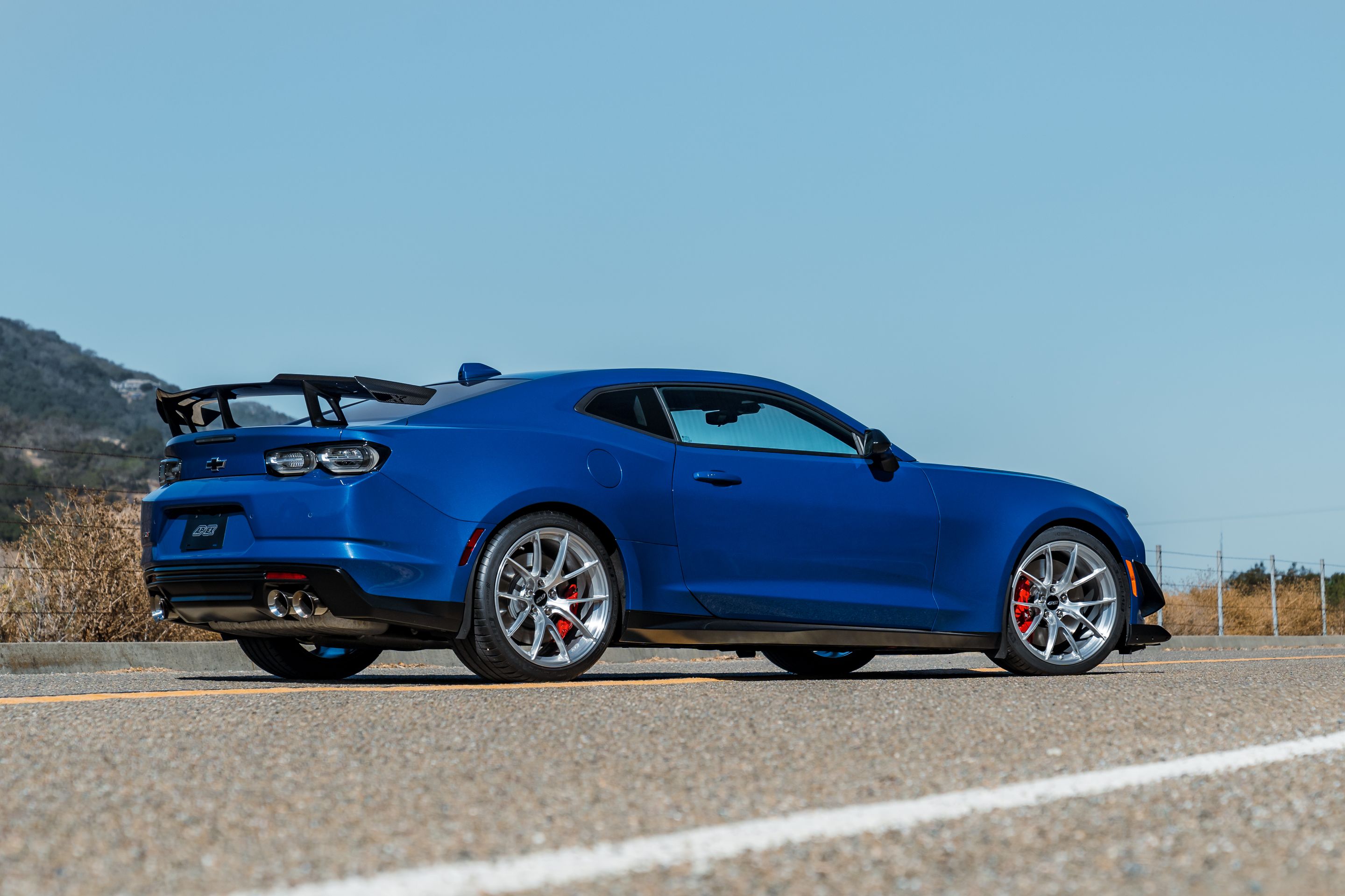 Blue Chevrolet 6th Gen Camaro ZL1 1LE with 20" VS-5RS Apex wheels in Brushed Clear