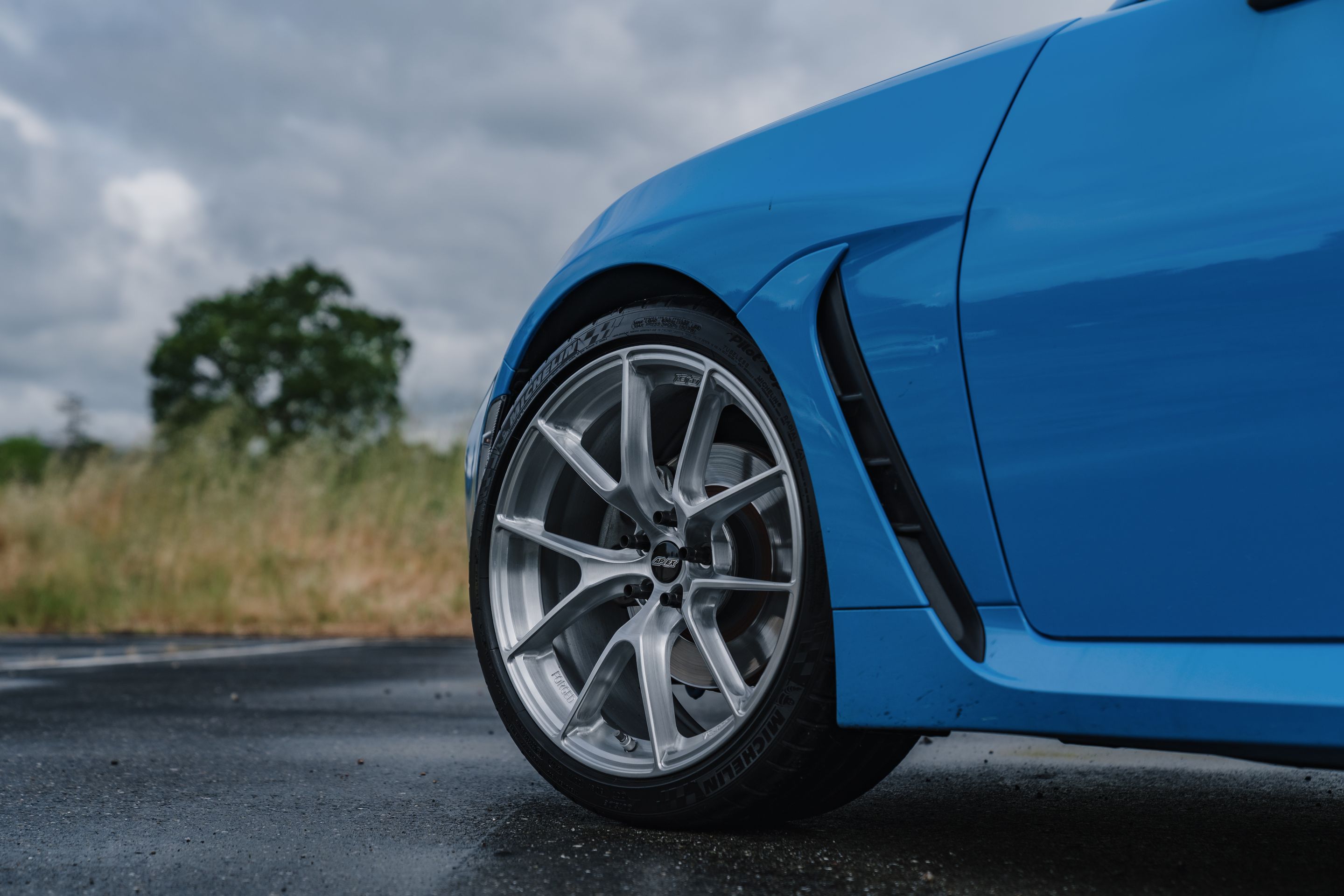 Blue Toyota GR86 with 18" VS-5RS Apex wheels in Brushed Clear