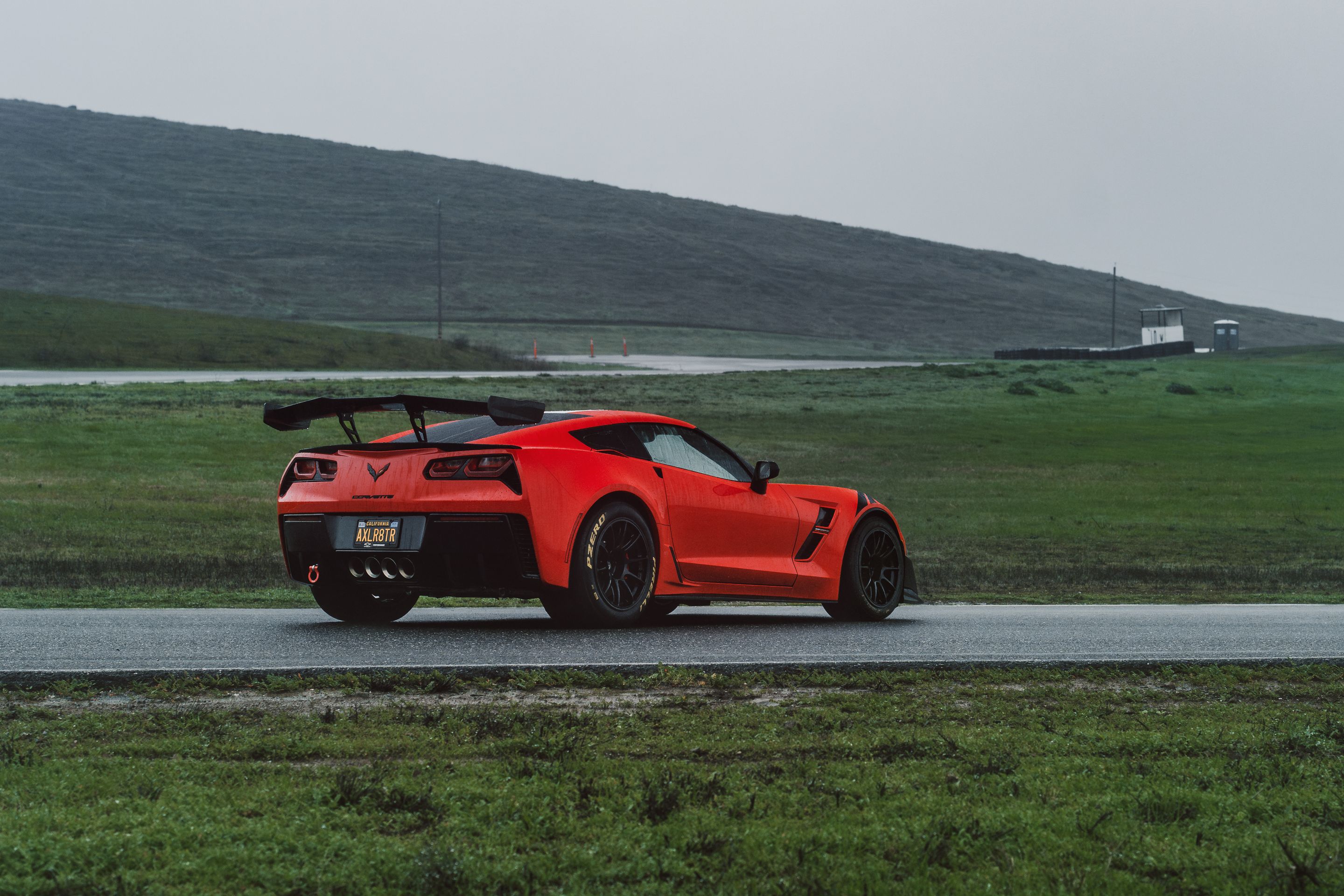 Red Chevrolet C7 Corvette Grand Sport with 18" SM-10RE Apex wheels in Satin Black
