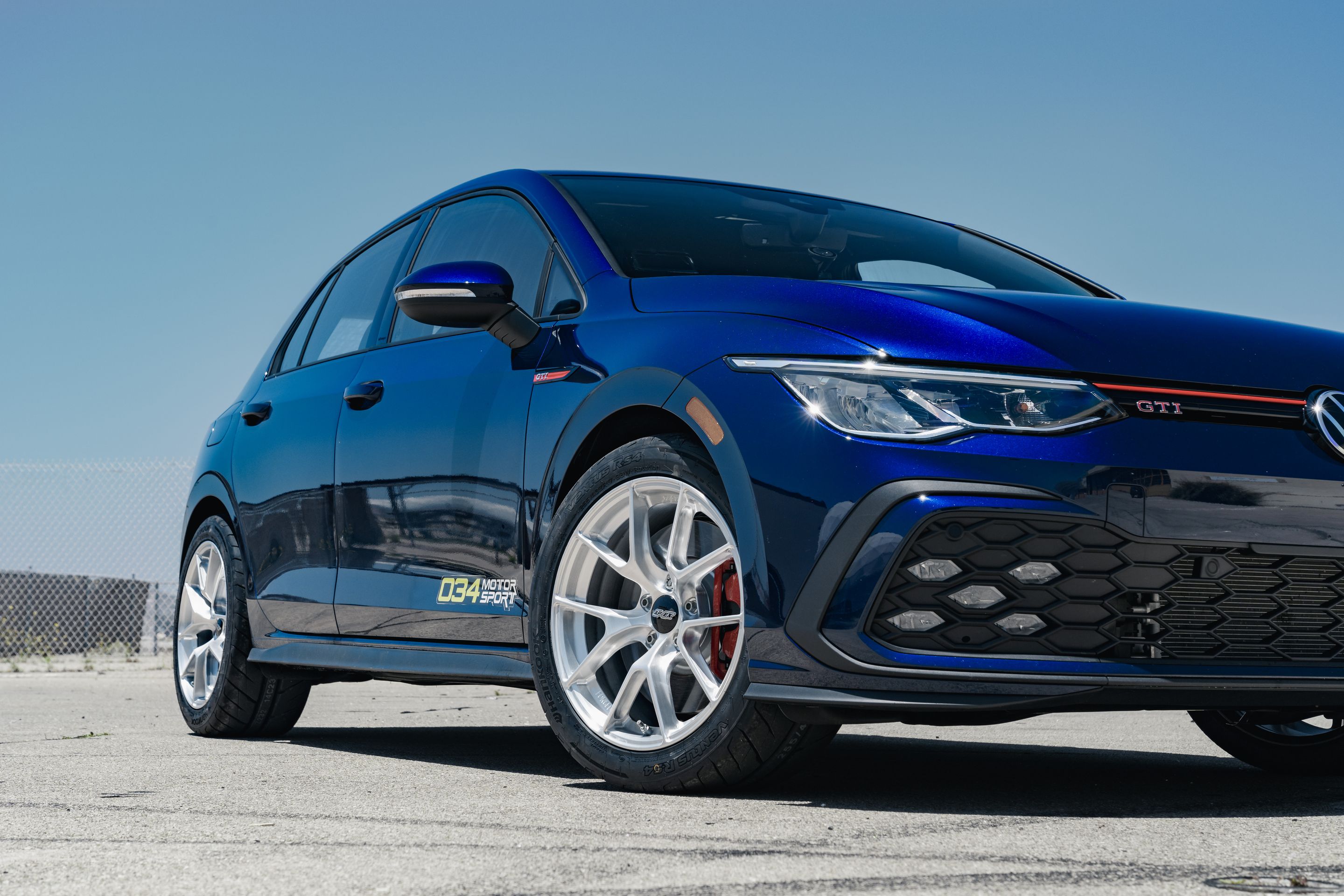 Blue VW MK8 GTI with 17" VS-5RS Apex wheels in Brushed Clear